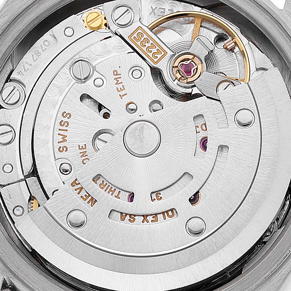 This image shows a close-up of the Rolex President 79159 Women's White Gold Silver Dial 79159 Women's White Gold Silver Dial model's internal movement mechanism, highlighting its intricate components and engravings.