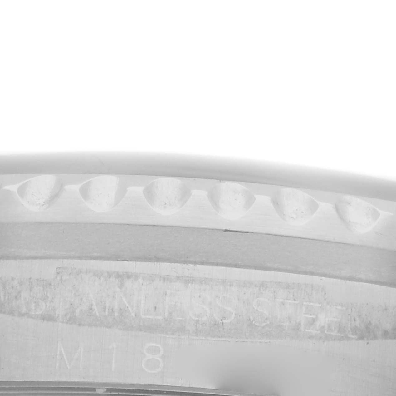 The image shows a close-up of the bezel edge and casing side of a Rolex Sea-Dweller 16600 Men's Stainless Steel Black Dial 16600 Men's Stainless Steel Black Dial watch, focusing on its stainless steel material.