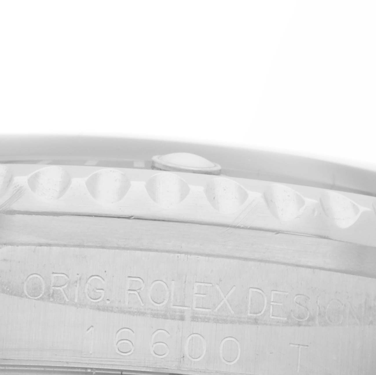 The image shows a close-up of the case side and bezel of a Rolex Sea-Dweller 16600 Men's Stainless Steel Black Dial 16600 Men's Stainless Steel Black Dial, highlighting the engraved model details.