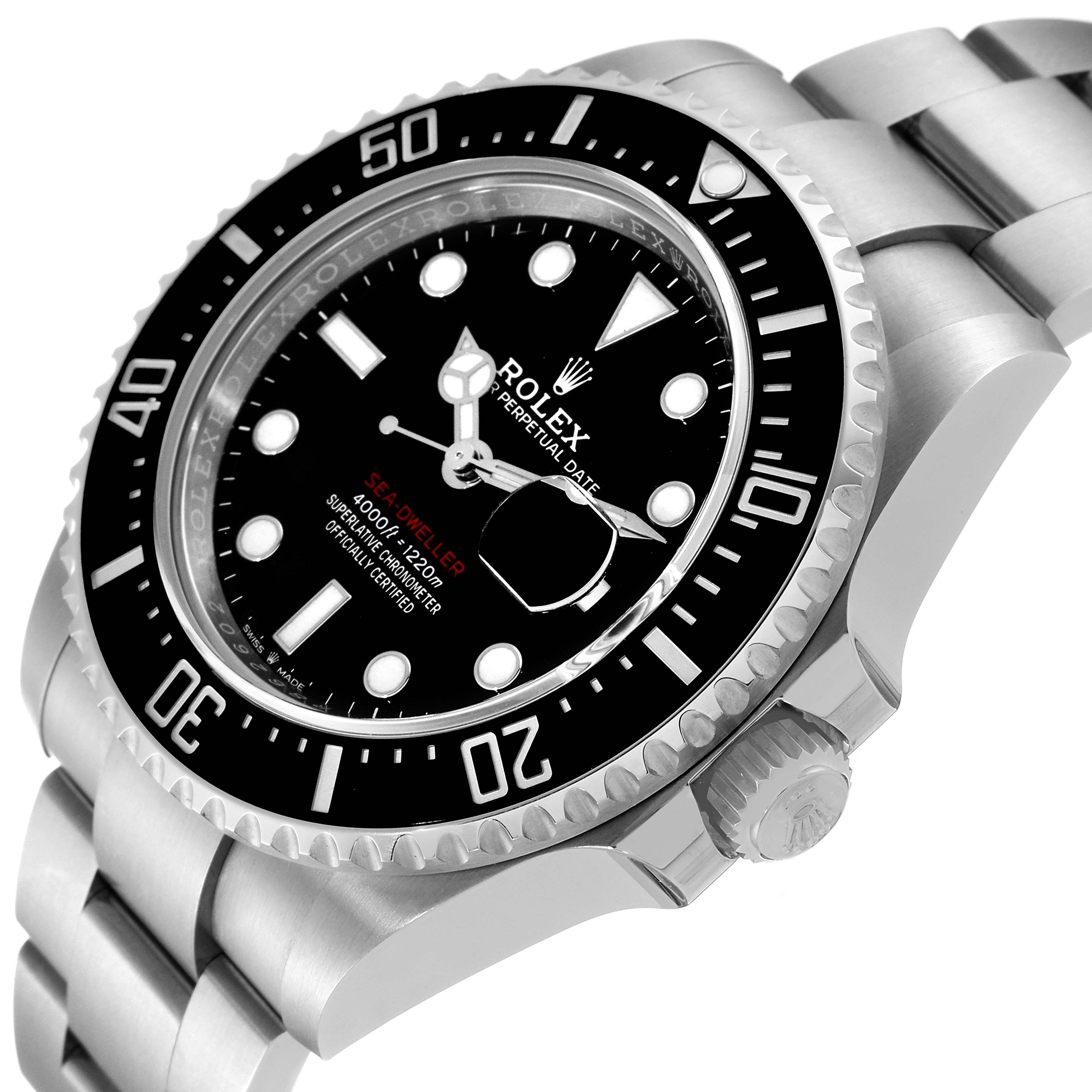 The image shows a close-up angled view of the Rolex Sea-Dweller 126600 Men
s Stainless Steel Black Dial 126600 Men
s Stainless Steel Black Dial watch, highlighting the bezel, dial, and part of the bracelet.