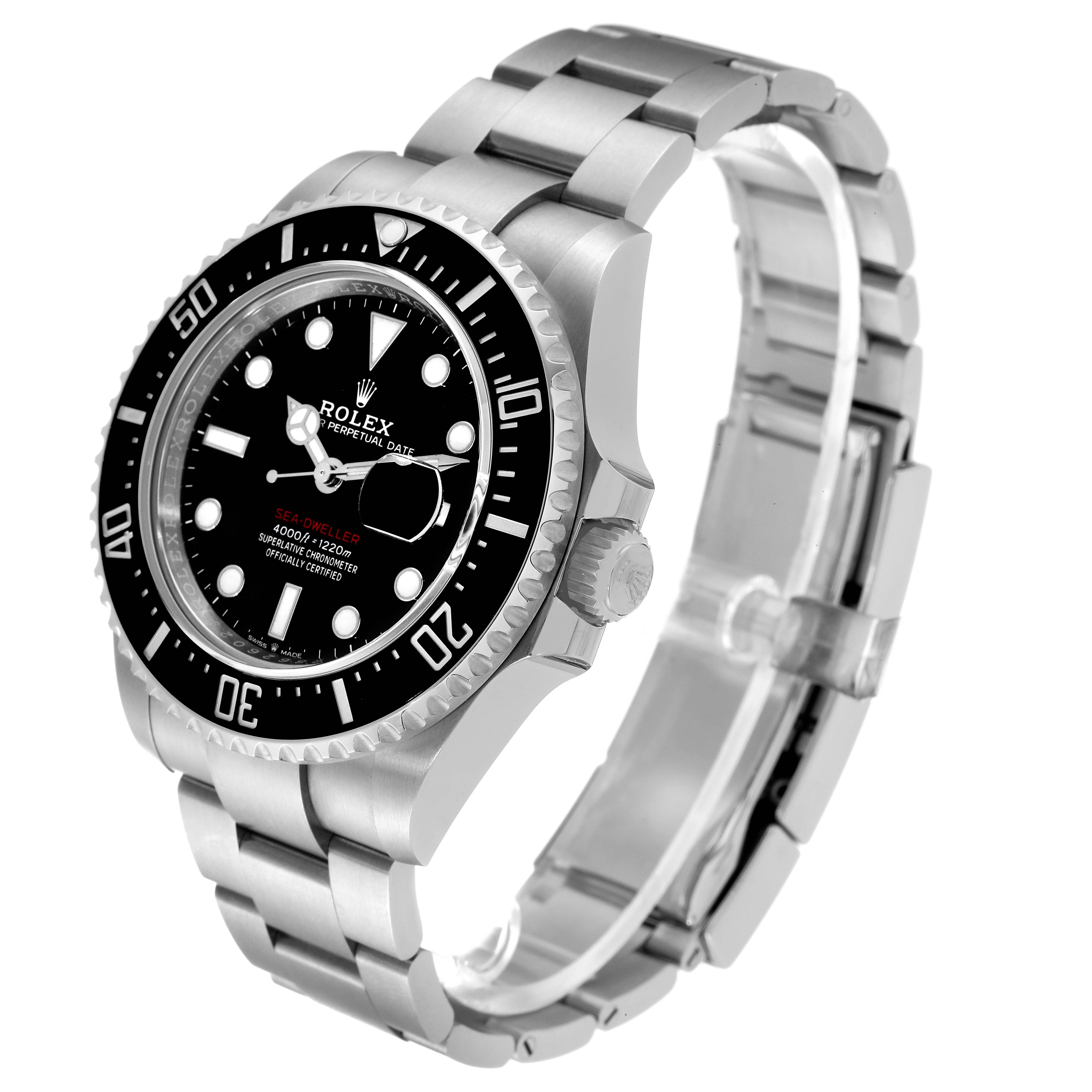 The Sea-Dweller Rolex watch is angled from the front-left, displaying the dial, bezel, crown, and bracelet.