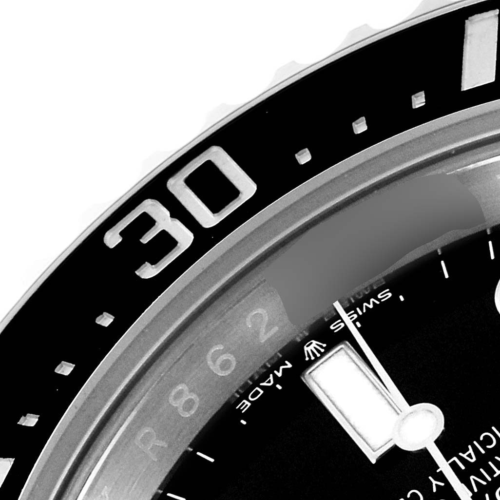 The image shows a close-up angle of the bezel and partial dial of the Rolex Sea-Dweller 126600 Men
s Stainless Steel Black Dial 126600 Men
s Stainless Steel Black Dial watch, highlighting the 30-minute mark.