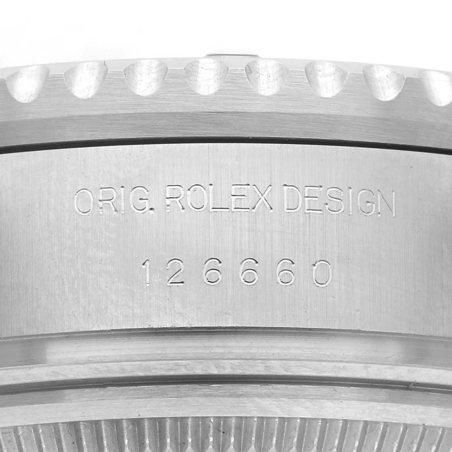 The image shows the side view of a Rolex Sea-Dweller 126660 Men's Stainless Steel Black Dial 126660 Men's Stainless Steel Black Dial, focusing on the engraved serial and model number on the case.