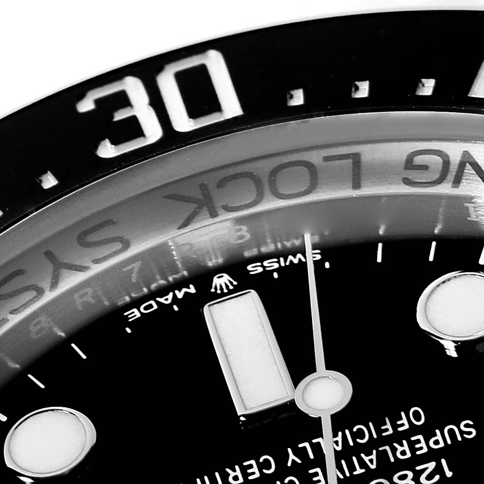 This close-up shows the dial and part of the bezel of the Rolex Sea-Dweller 136660 Men
s Stainless Steel Black Dial 136660 Men
s Stainless Steel Black Dial model watch.