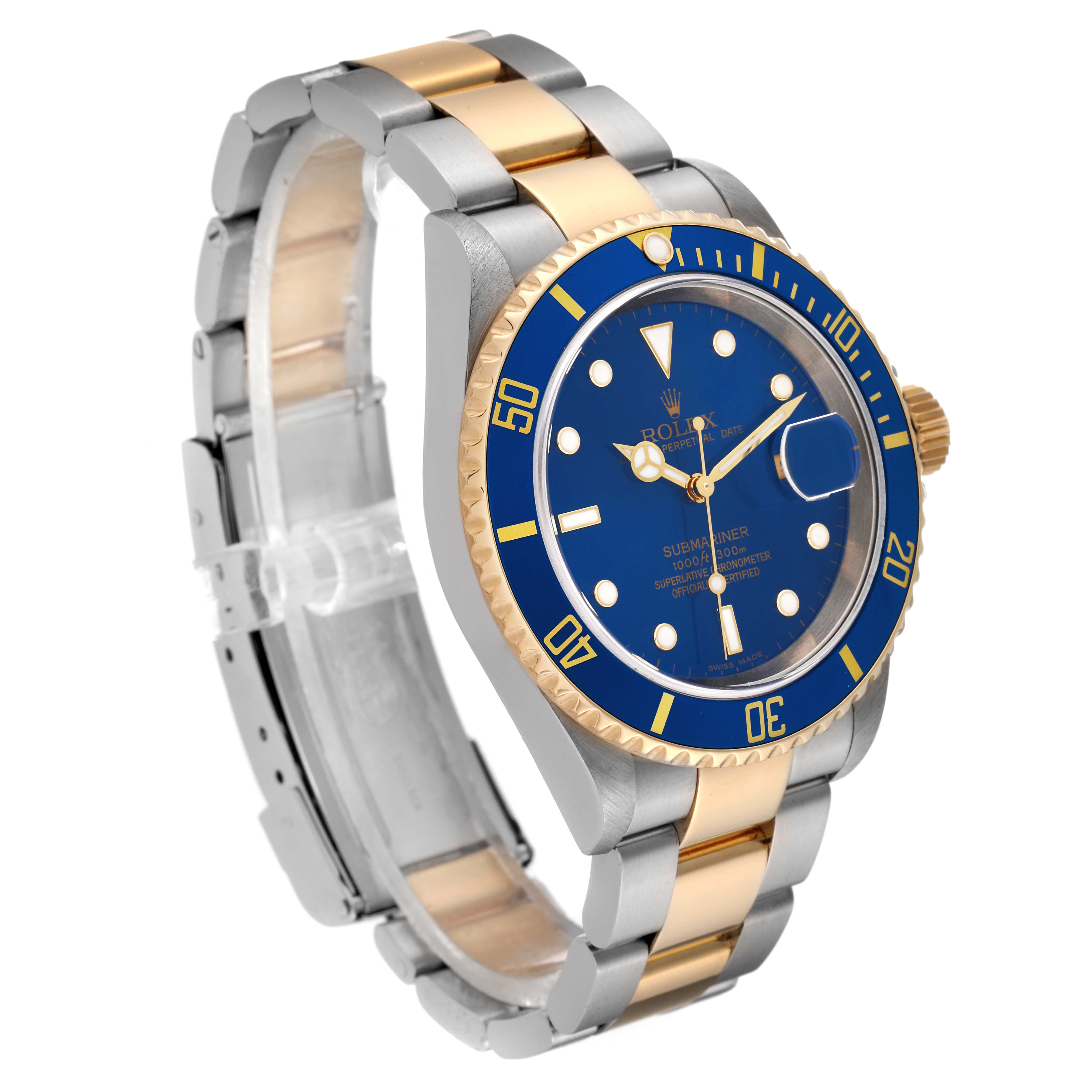The image shows a Rolex Submariner 16613 Men's Steel and Gold (two tone) Blue Dial 16613 Men's Steel and Gold (two tone) Blue Dial watch at a slight angle, displaying its blue dial, gold bezel, and two-tone bracelet.