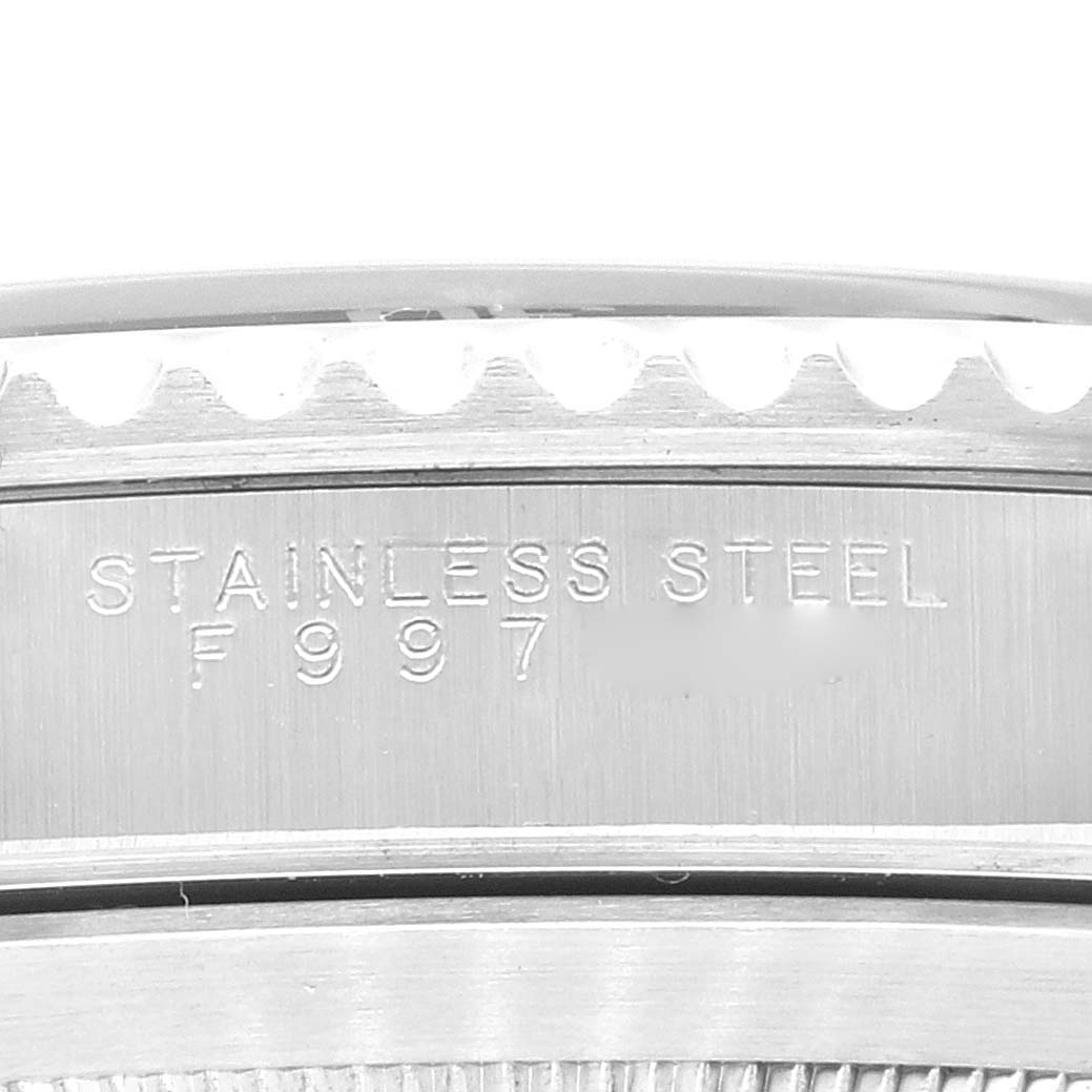 This image shows a close-up of the engravings on the stainless steel case side of a Rolex Submariner 14060M Men
s Stainless Steel Black Dial 14060M Men
s Stainless Steel Black Dial watch.