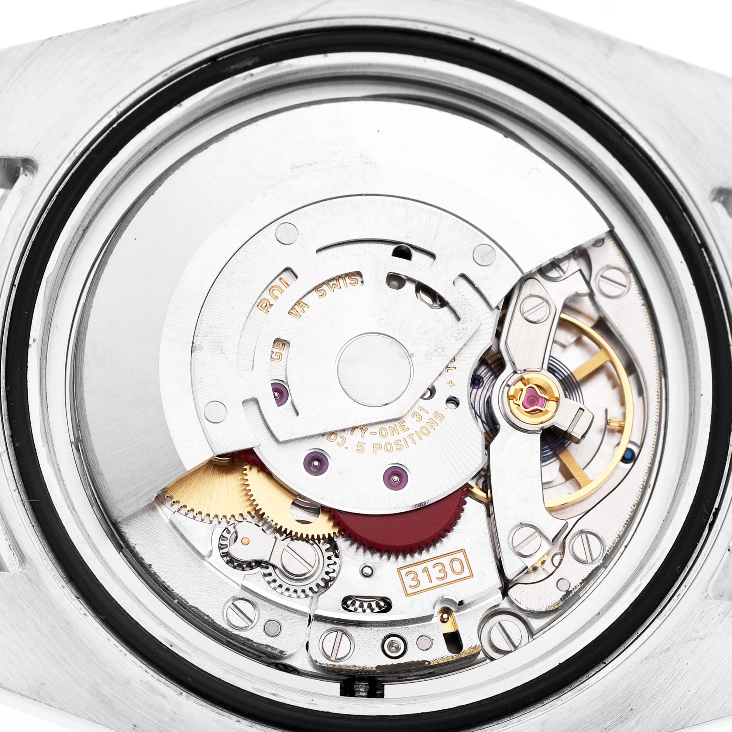 This image shows the movement of a Rolex Submariner 114060 Men's Stainless Steel Black Dial watch, focusing on the internal mechanics and gears.