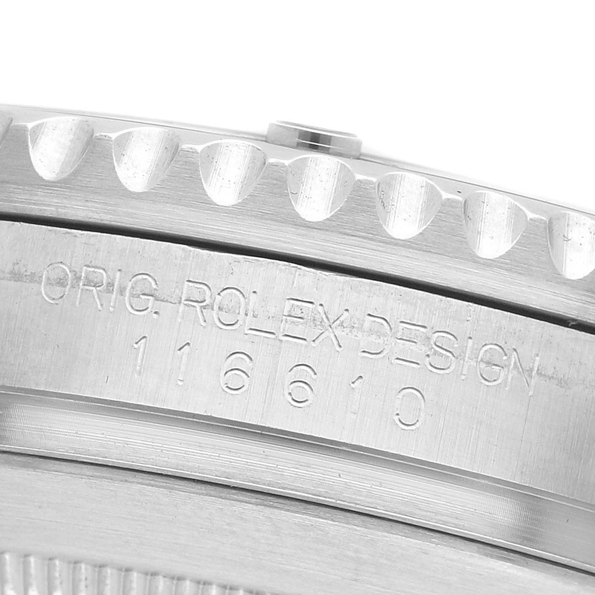 The image shows a close-up of the engraved side of a Rolex Submariner 116610LV Men's Stainless Steel Green Dial, highlighting the bezel edge and model number.