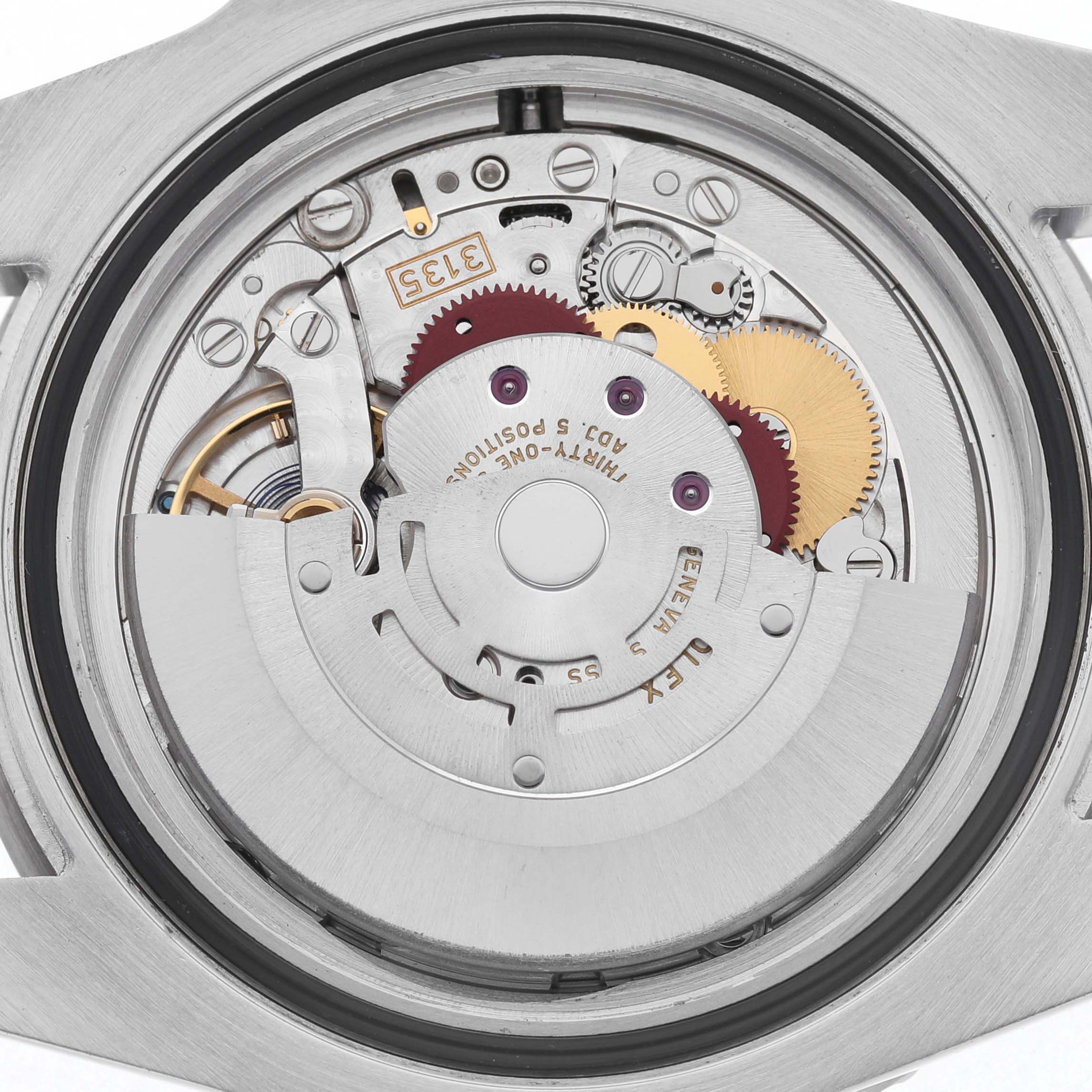 The image shows the movement of a Rolex Submariner 116610LV Men's Stainless Steel Green Dial watch from a back angle, highlighting gears and rotor.