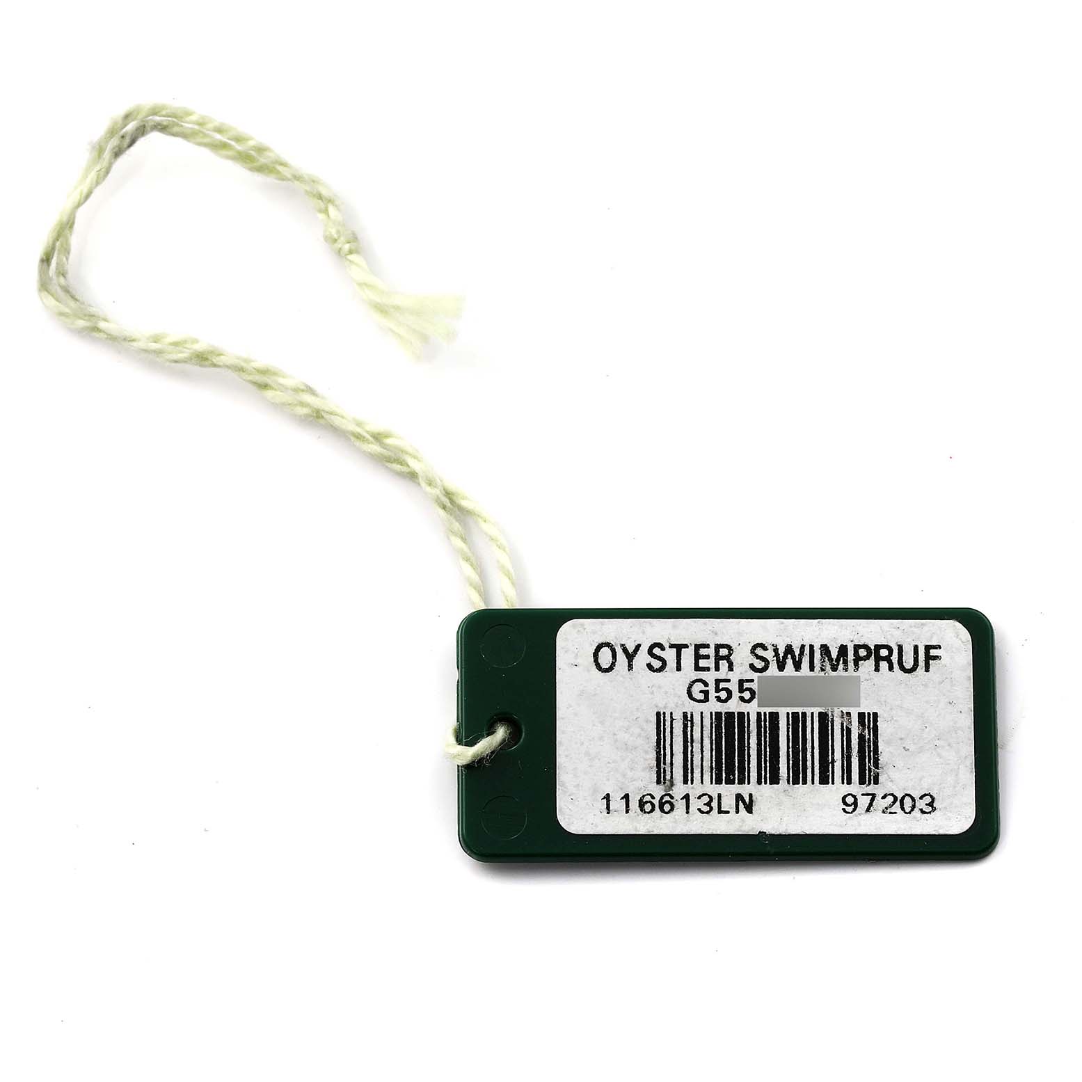 This image shows a green label tag with a string, associated with the Rolex Submariner 116613 Men's Steel and Gold (two tone) Black Dial 116613 Men's Steel and Gold (two tone) Black Dial watch, featuring "Oyster Swimpruf" text.