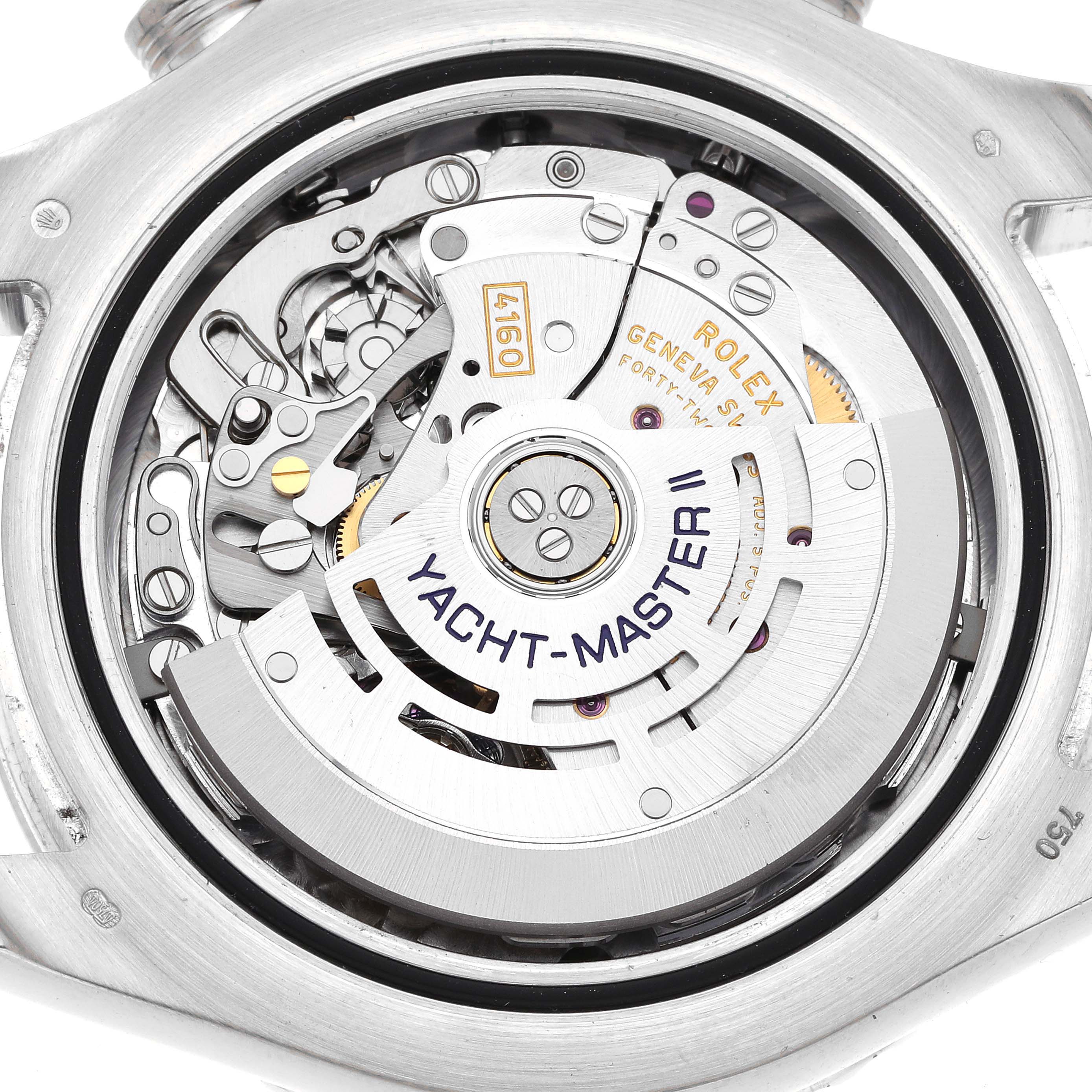 The image shows the internal mechanism of a Rolex Yacht-Master 116689 Men
s Platinum White Dial 116689 Men
s Platinum White Dial watch from a back view, highlighting gears and the rotor.