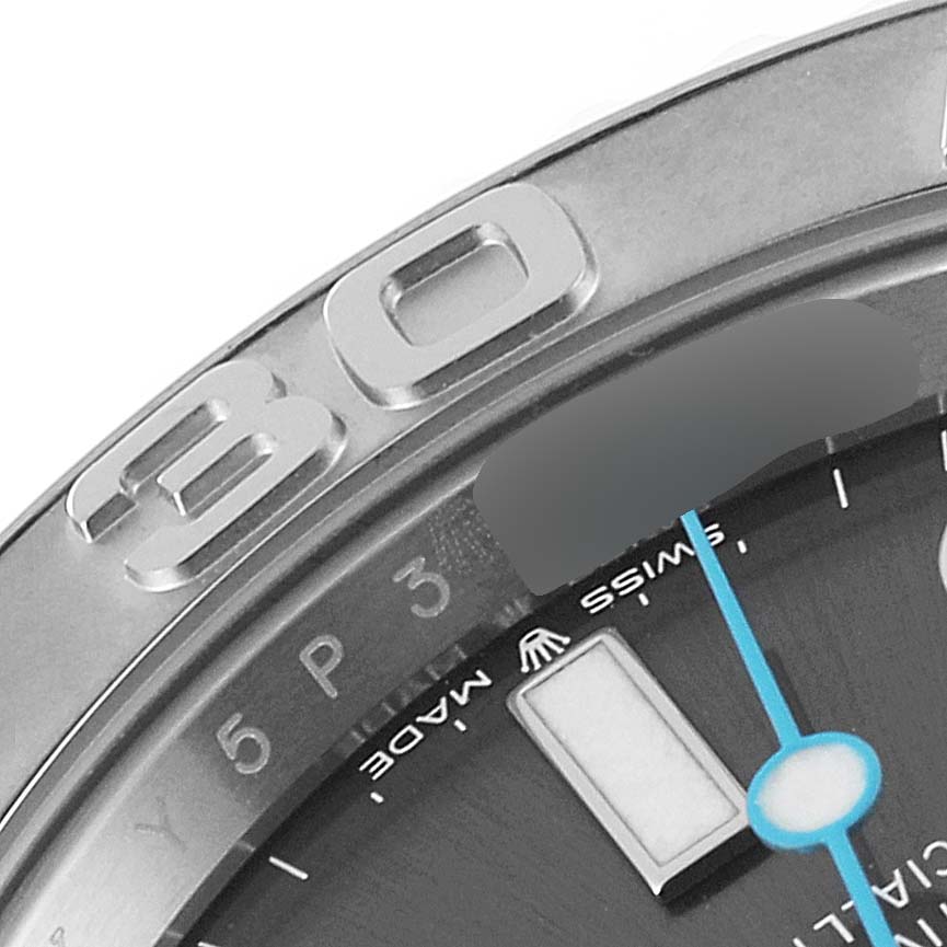 This close-up angle of the Rolex Yacht-Master 126622 Men
s Stainless Steel Grey Dial 126622 Men
s Stainless Steel Grey Dial watch shows part of the bezel, the 
30
 numeral, and a portion of the dial.