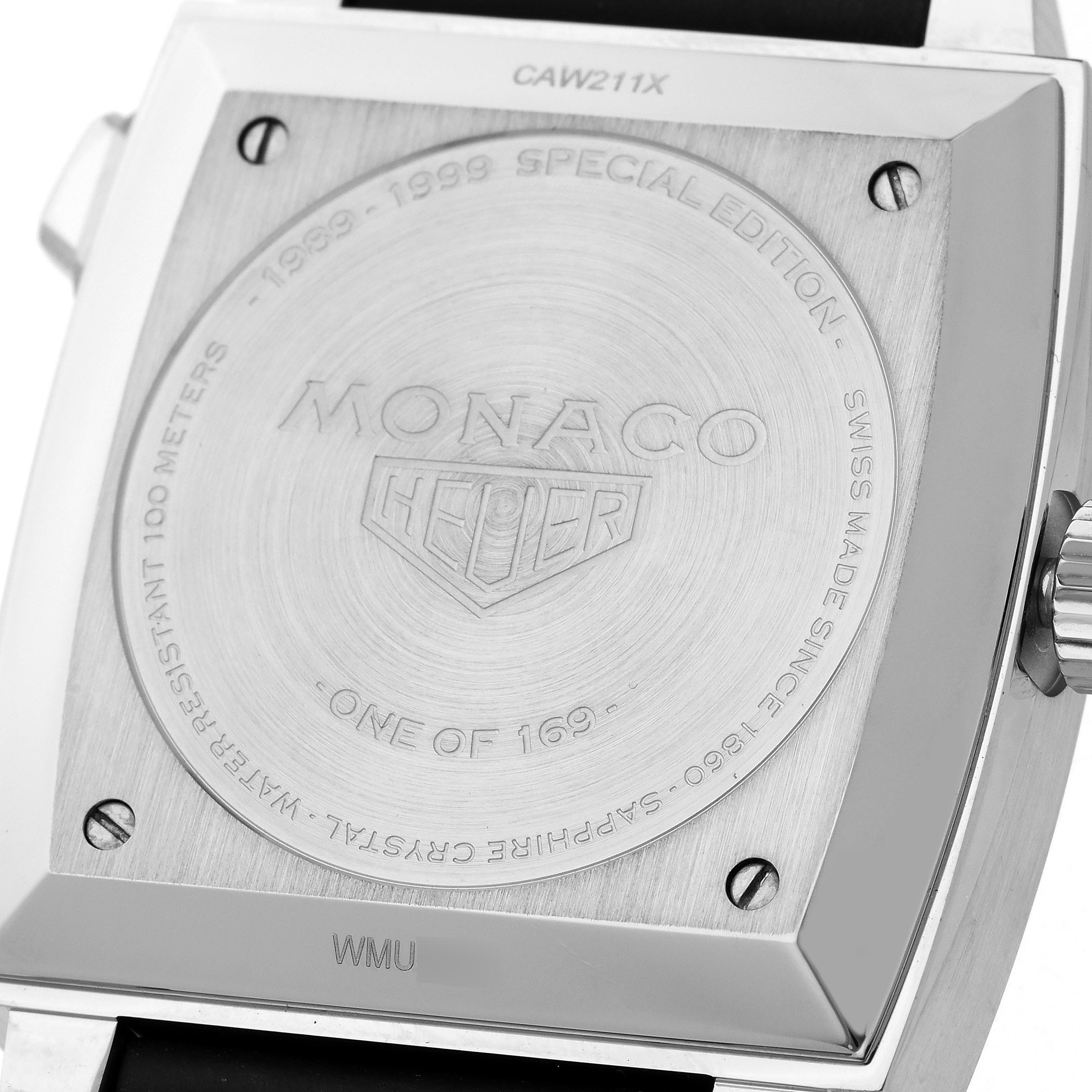 The image shows the back of a Tag Heuer Monaco CAW211X.FC6468 Men's Stainless Steel Grey Dial CAW211X.FC6468 Men's Stainless Steel Grey Dial watch, highlighting engravings and the crown from a side angle.
