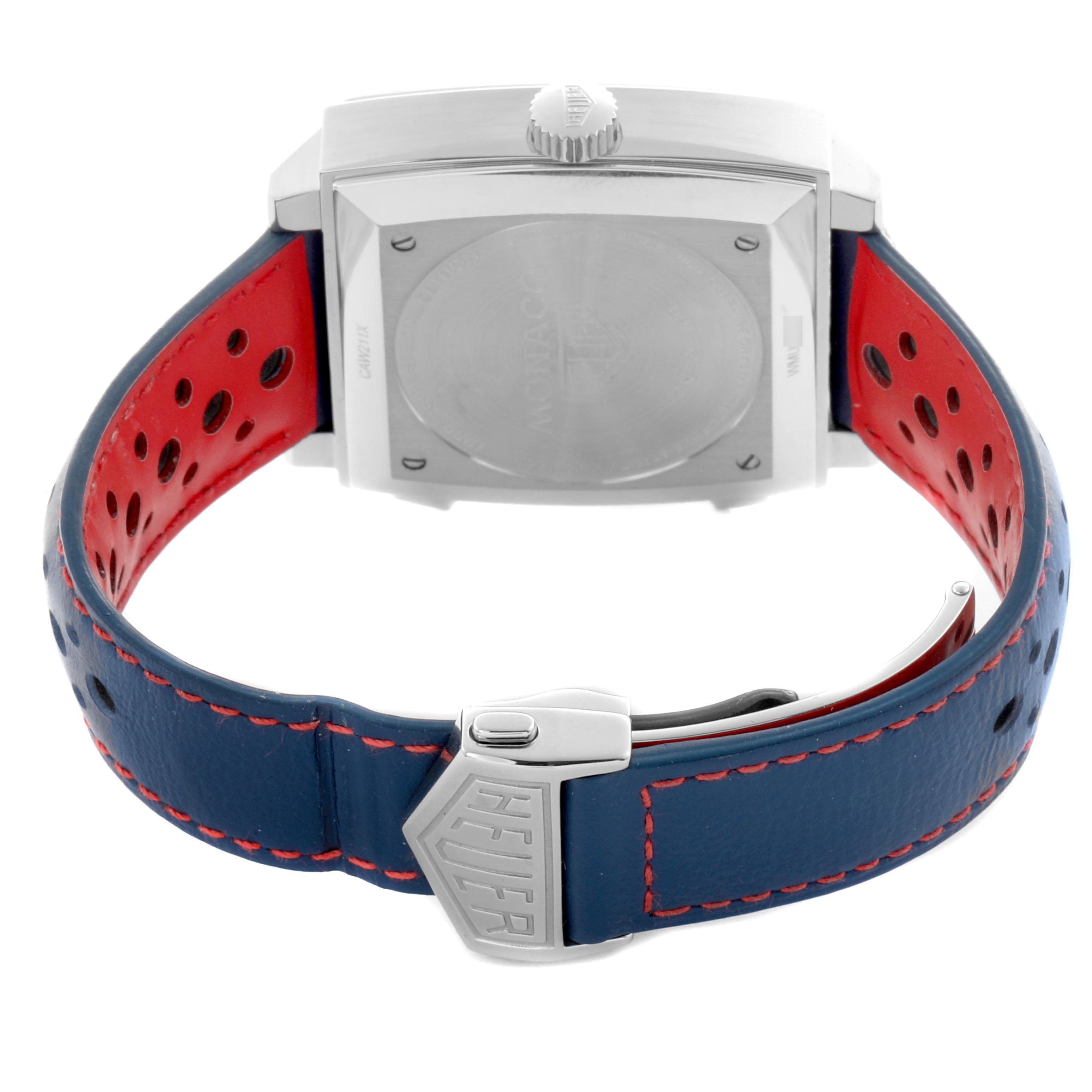 The Tag Heuer Monaco CAW211X.FC6468 Men's Stainless Steel Grey Dial CAW211X.FC6468 Men's Stainless Steel Grey Dial watch is shown from the back, highlighting the clasp, case back, and perforated strap.