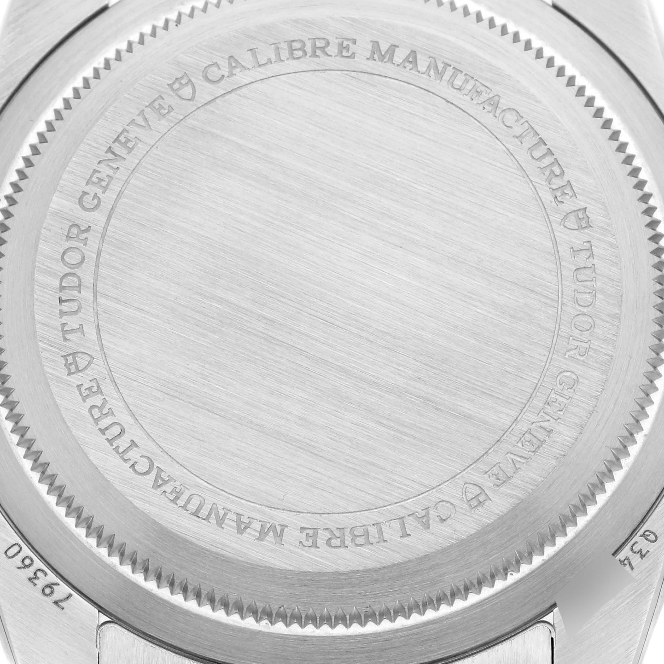 The image shows the back case of a Tudor Heritage Black Bay 79360N Men's Stainless Steel Silver Dial 79360N Men's Stainless Steel Silver Dial watch, featuring engraved branding and details.