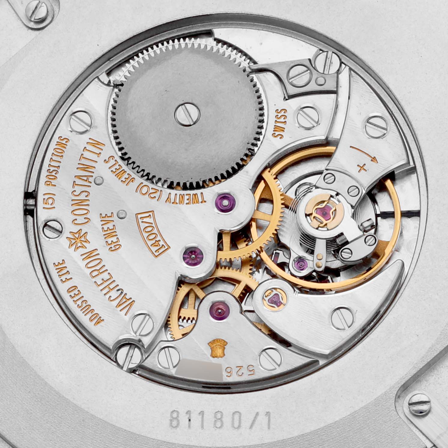 The image shows the movement of a Vacheron Constantin Patrimony 81180/000P-9539 Men's Platinum Grey Dial 81180/000P-9539 Men's Platinum Grey Dial watch, highlighting gears and internal mechanics from the back angle.
