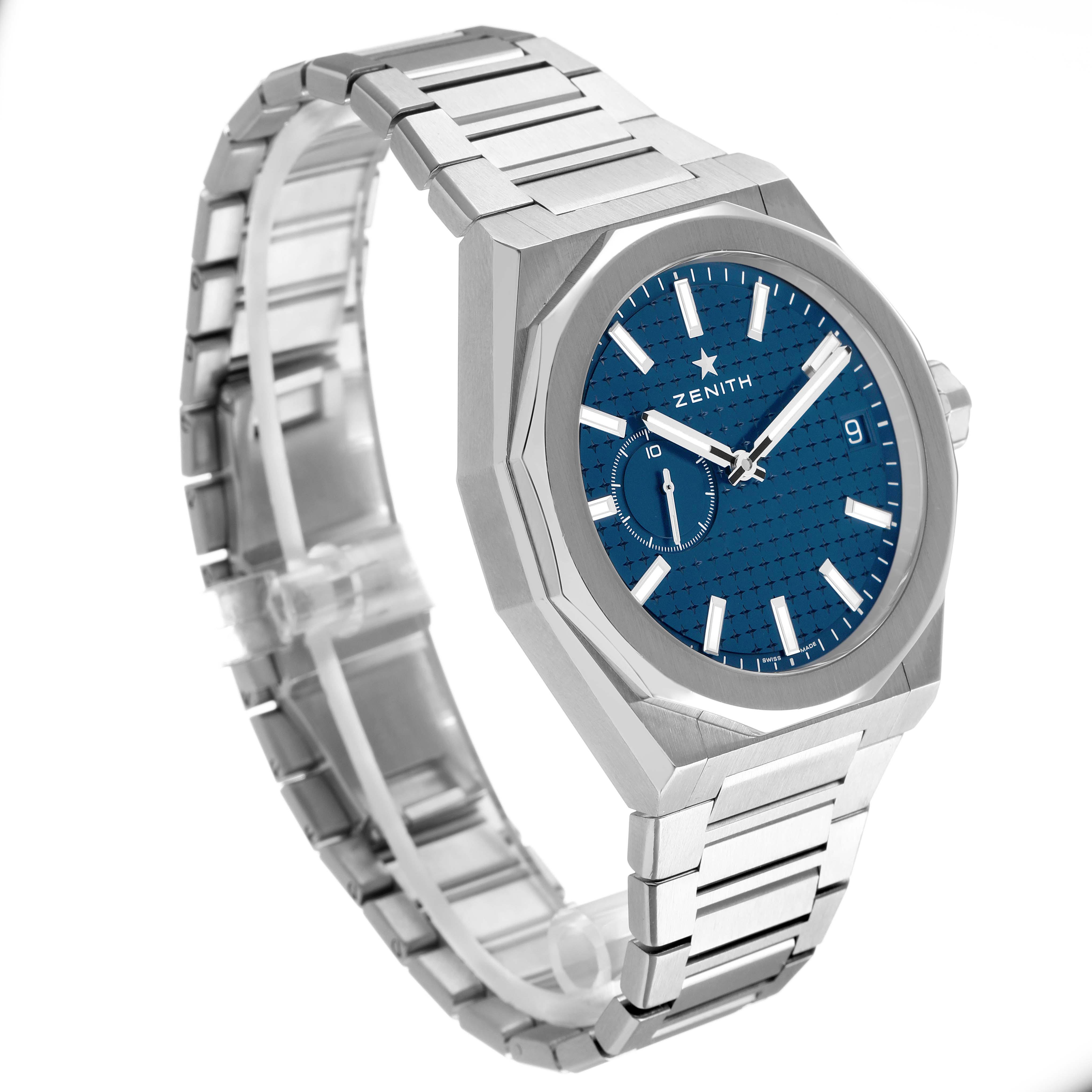 The Zenith Defy 03.9300.3620 Men's Stainless Steel Blue Dial watch is shown at a three-quarter angle, highlighting the dial, hands, bezel, crown, and metal bracelet.