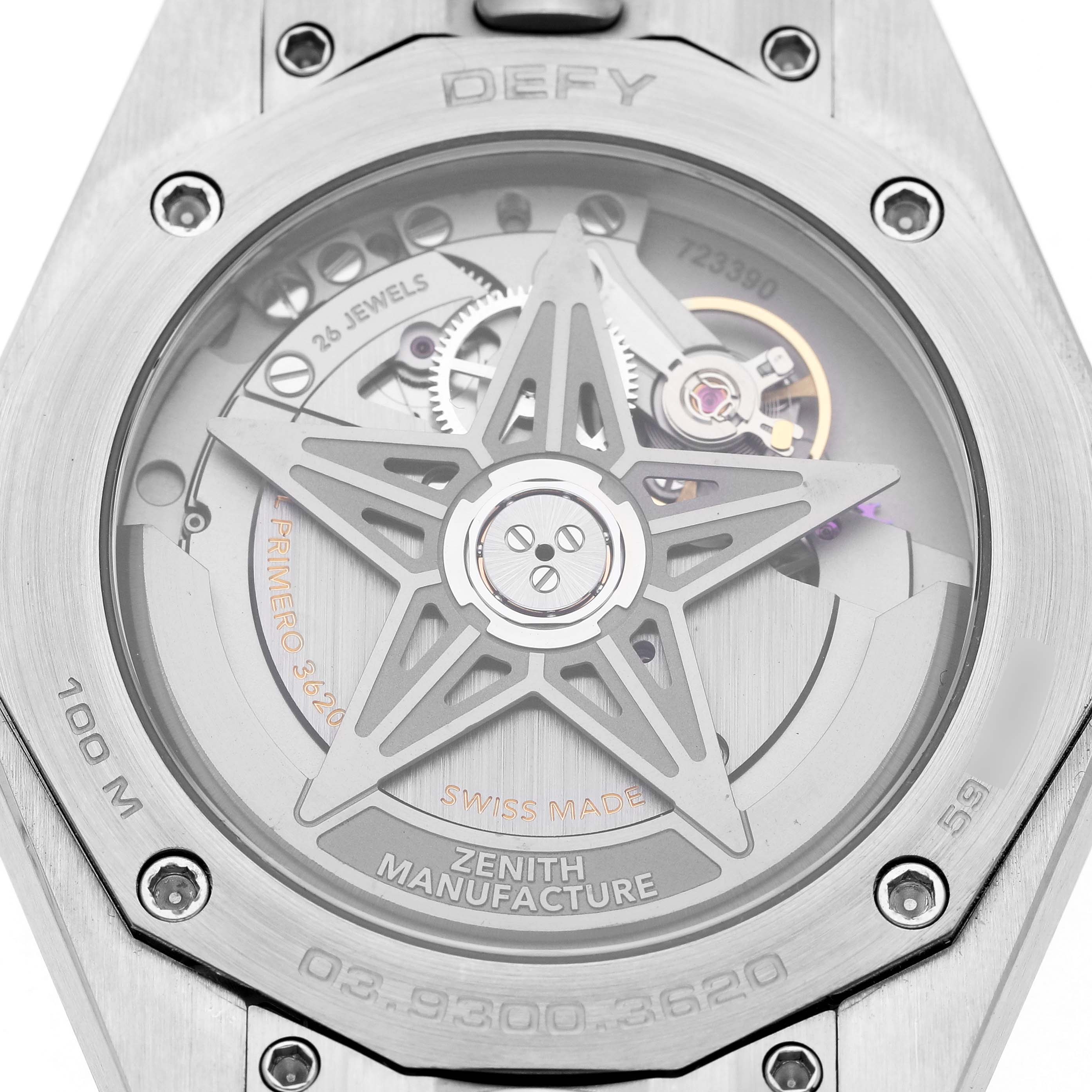 The image shows the back of a Zenith Defy 03.9300.3620 Men's Stainless Steel Blue Dial watch, highlighting the movement and star-shaped rotor.