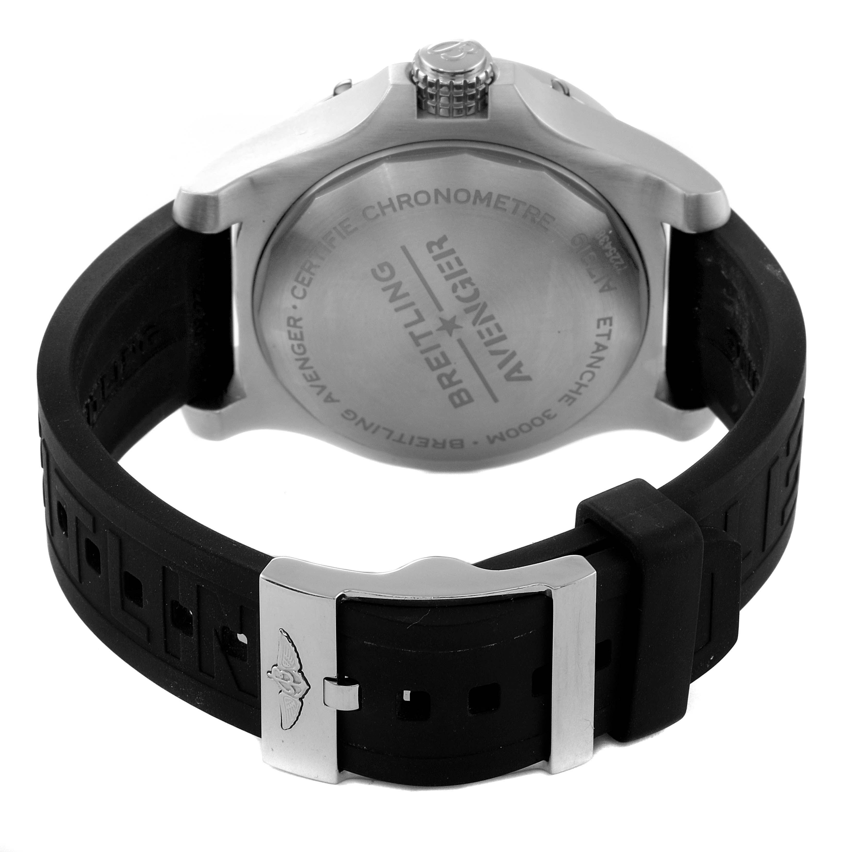 This image shows the back case and clasp of a Breitling Avenger A17319 Men's Stainless Steel Yellow Dial A17319 Men's Stainless Steel Yellow Dial model watch, featuring a black rubber strap.