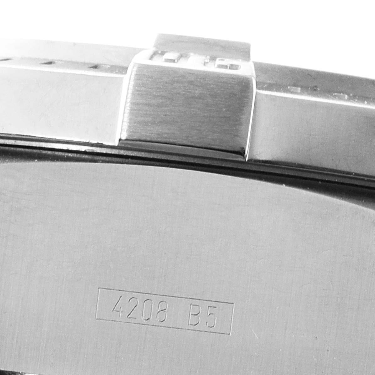 The image shows a close-up of the metal case back and part of the bezel of a Breitling Avenger A73390 Men's Stainless Steel Blue Dial A73390 Men's Stainless Steel Blue Dial watch, revealing the engraved model number.