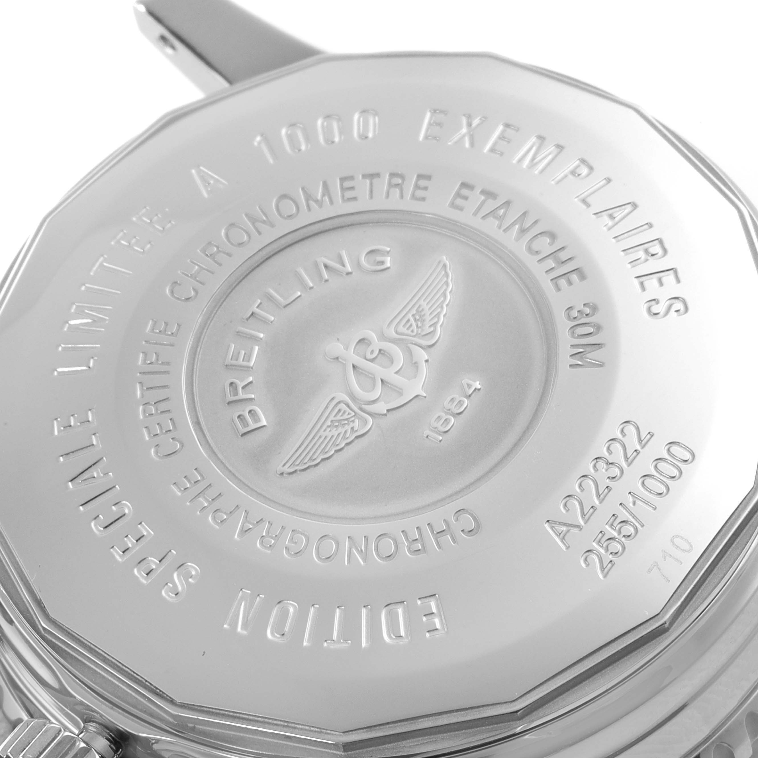 The image shows the back case of a Breitling Navitimer A22322 Men
s Stainless Steel Black Dial A22322 Men
s Stainless Steel Black Dial watch, highlighting its engravings and serial number.