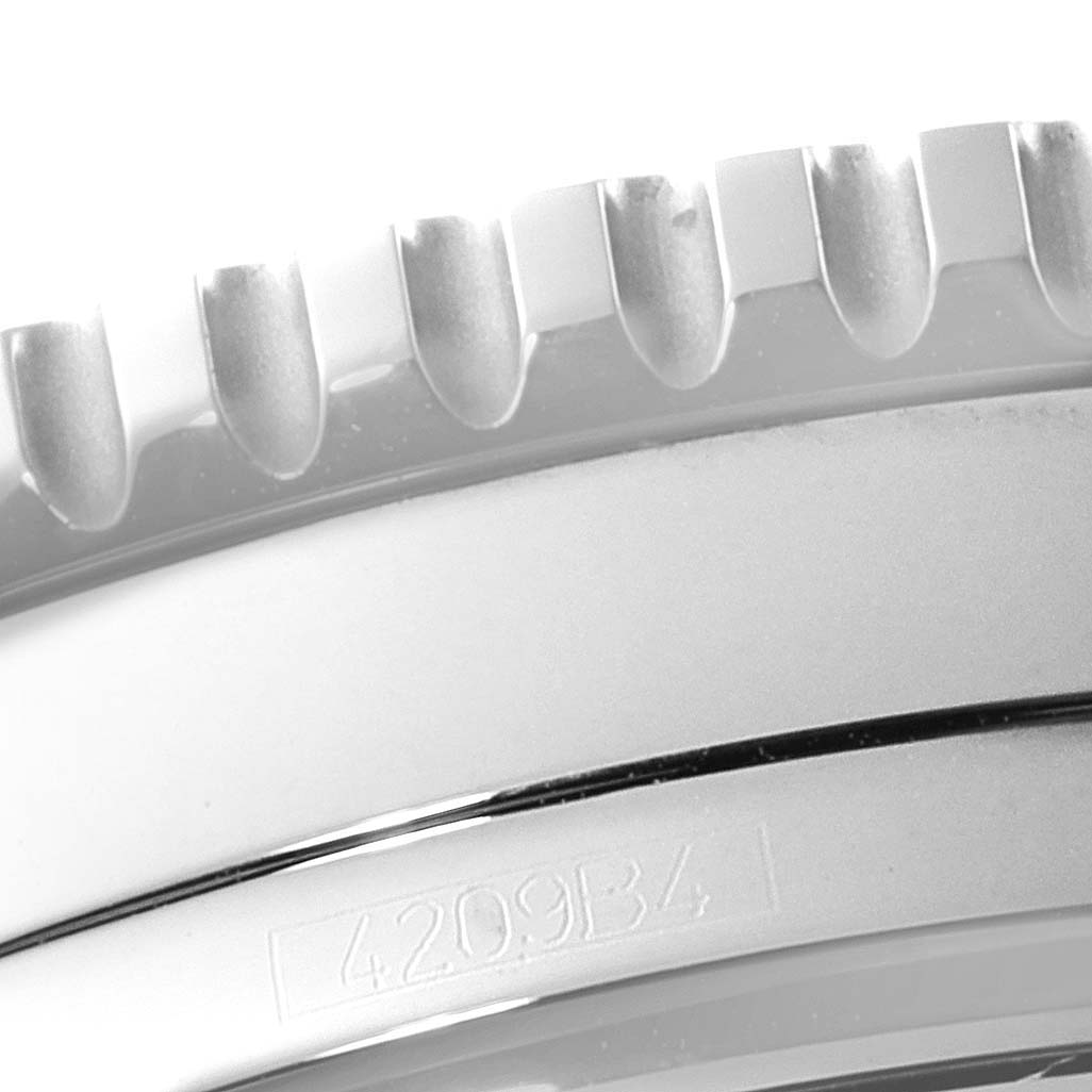 The image shows a close-up of the bezel and case of a Breitling Navitimer A22322 Men
s Stainless Steel Black Dial A22322 Men
s Stainless Steel Black Dial watch, featuring a serrated edge and part number.