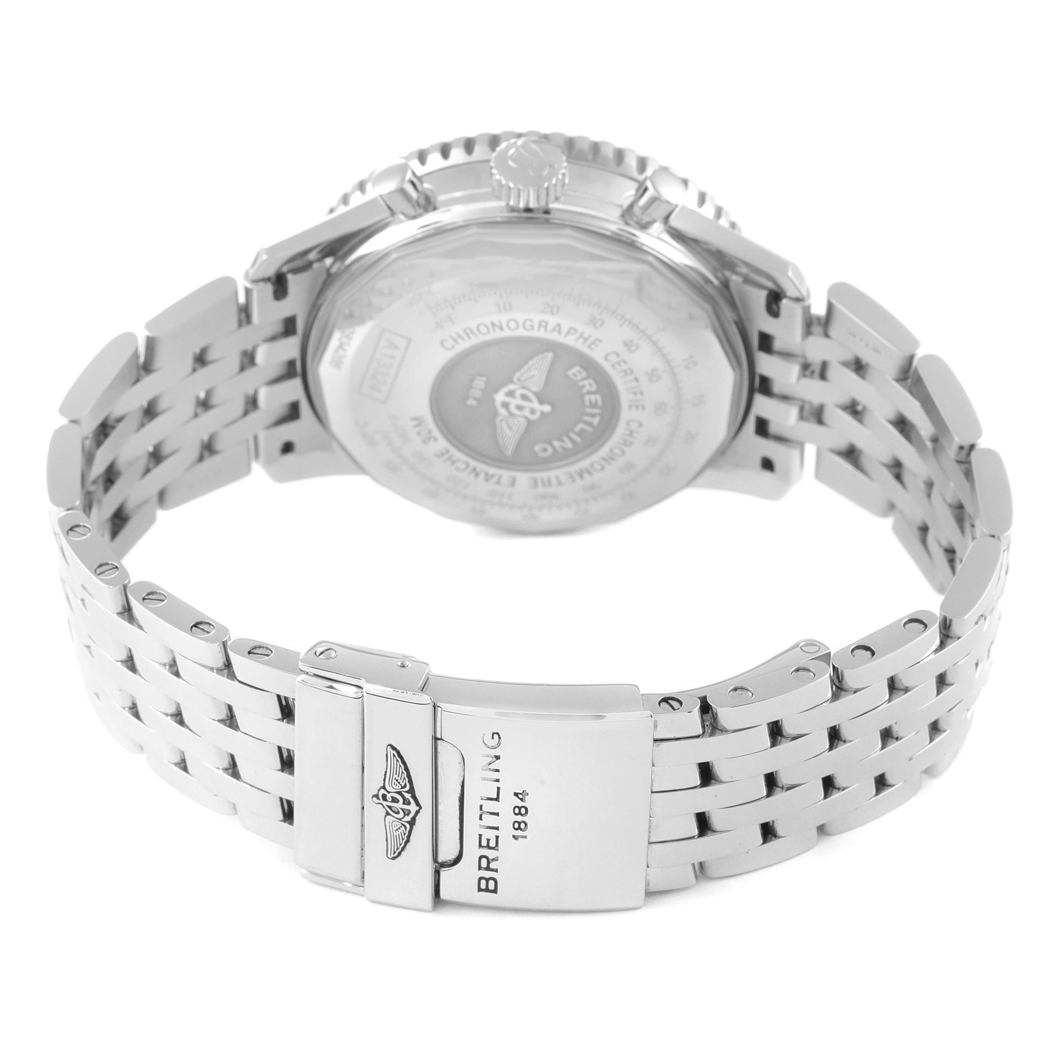 The image shows the back of a Breitling Navitimer A13324 Men
s Stainless Steel Blue Dial A13324 Men
s Stainless Steel Blue Dial watch and its stainless steel bracelet with the clasp visible.