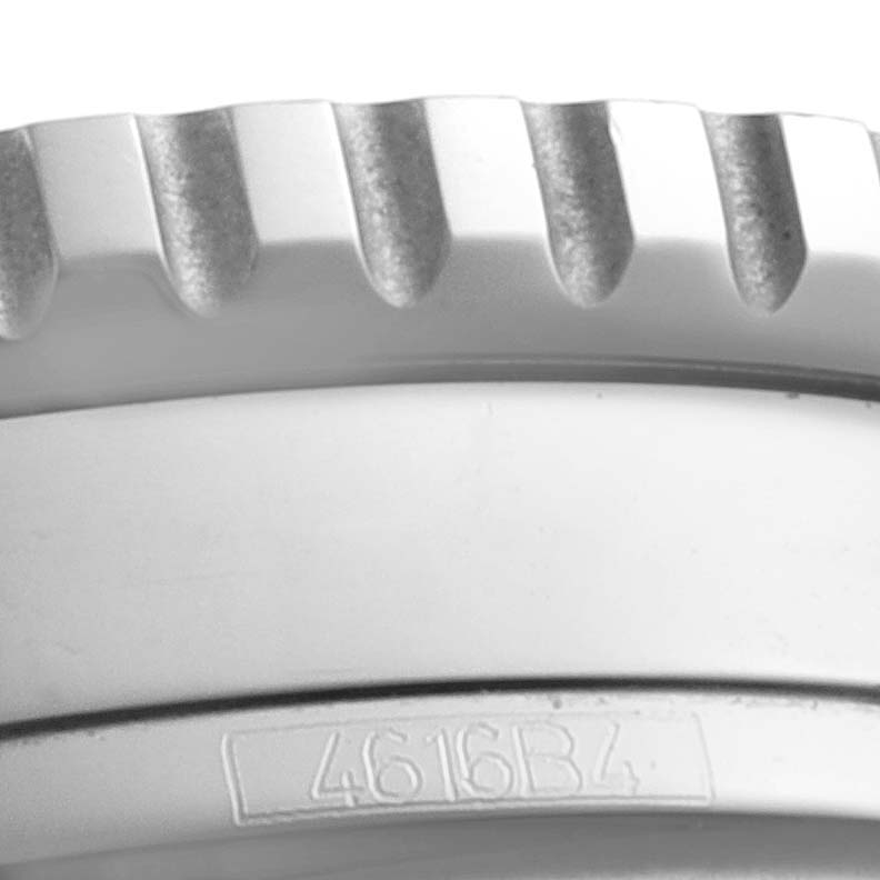 This close-up image shows the side view of the bezel and part of the casing with a serial number on the Breitling Navitimer A13324 Men
s Stainless Steel Blue Dial A13324 Men
s Stainless Steel Blue Dial watch.