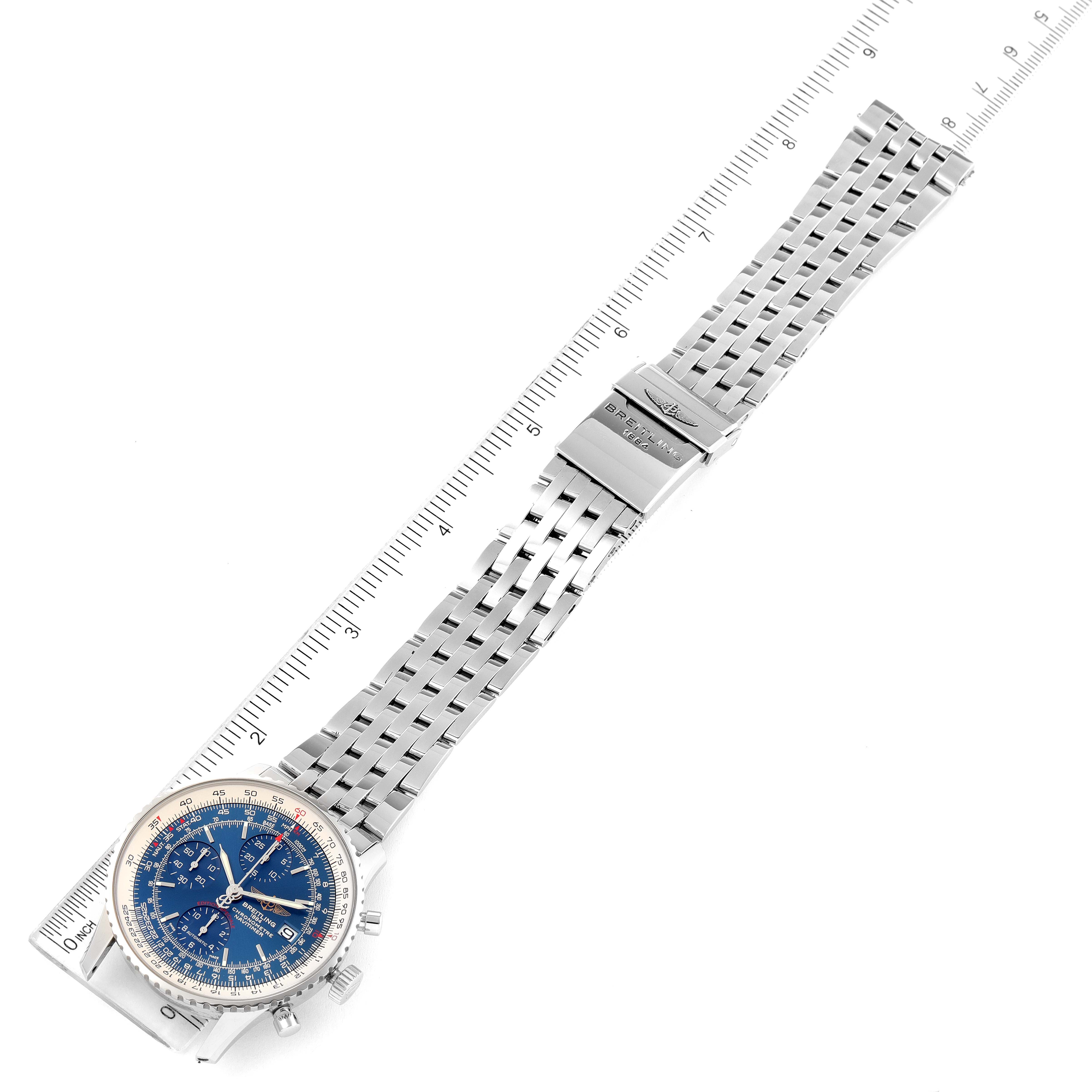 The image shows a Breitling Navitimer A13324 Men
s Stainless Steel Blue Dial A13324 Men
s Stainless Steel Blue Dial watch laid flat, showcasing its blue dial, stainless steel bracelet, and clasp, next to a ruler.