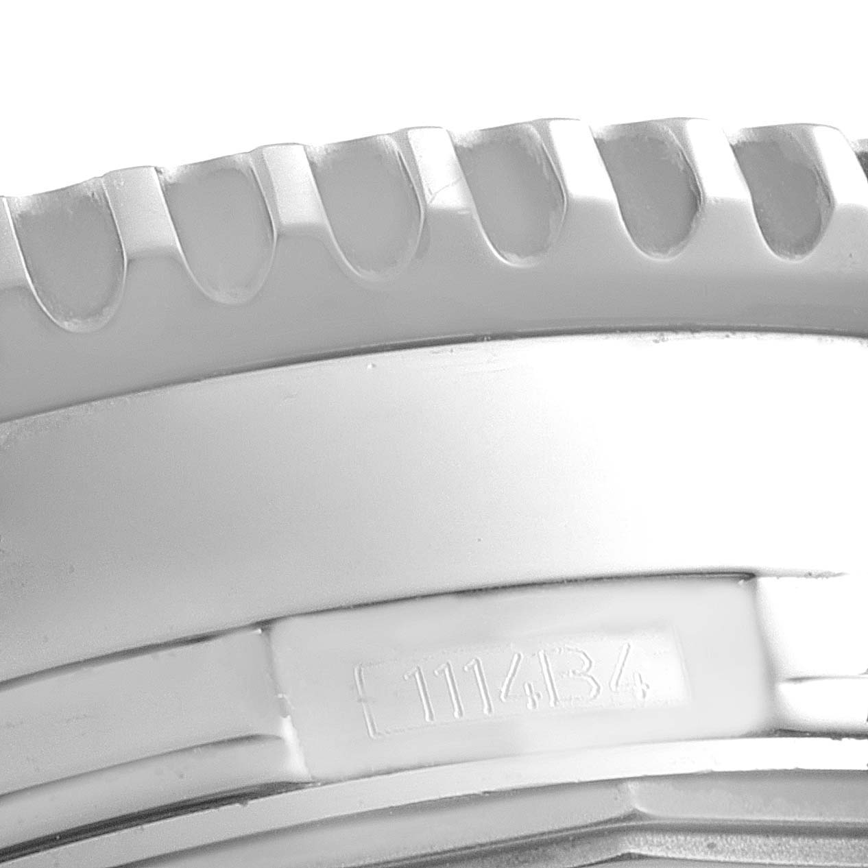 The image shows a close-up of the bezel and part of the case back of a Breitling Navitimer A24322 Men's Stainless Steel Black Dial A24322 Men's Stainless Steel Black Dial watch.