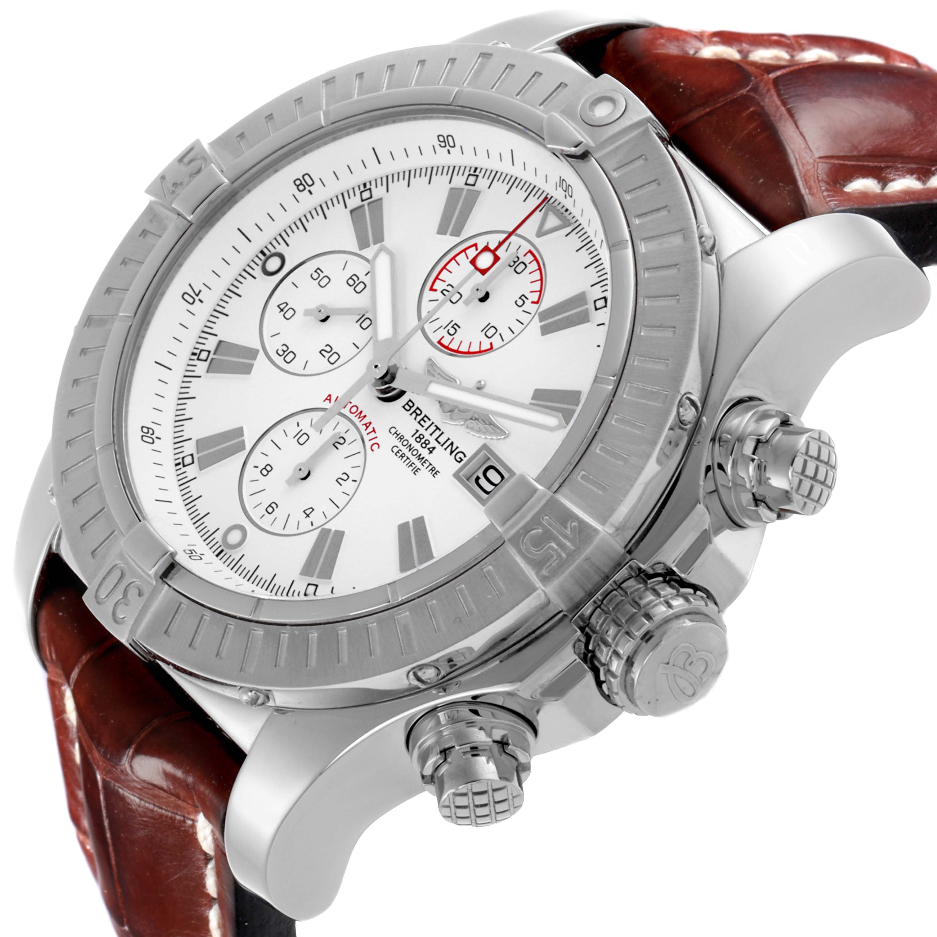 The Breitling Avenger A13370 Men's Stainless Steel White Dial A13370 Men's Stainless Steel White Dial watch is shown at a three-quarter angle, highlighting the bezel, crown, pushers, and brown leather strap.