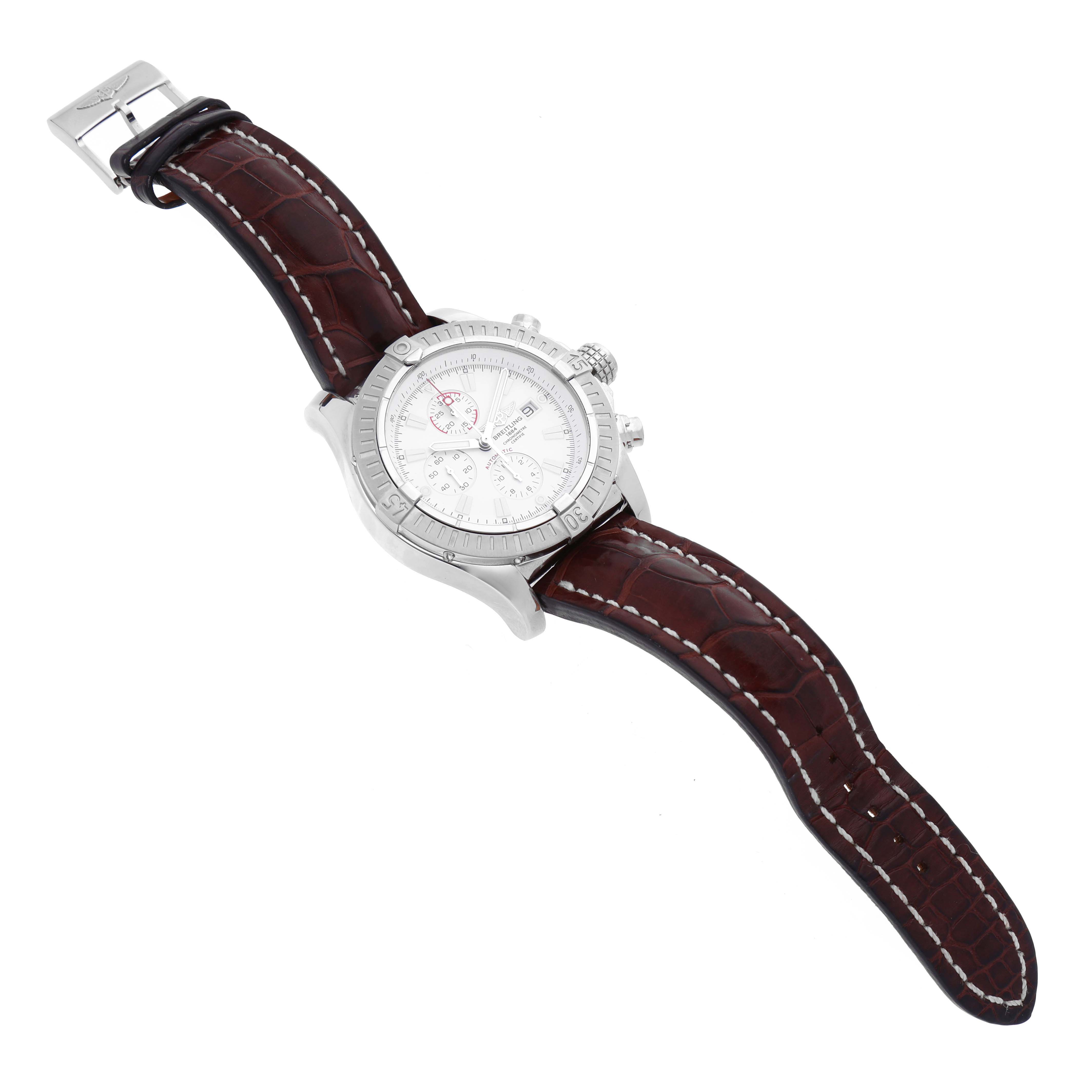 The Breitling Avenger A13370 Men's Stainless Steel White Dial A13370 Men's Stainless Steel White Dial watch is shown at a slight angle, displaying its face, case, crown, and leather strap.