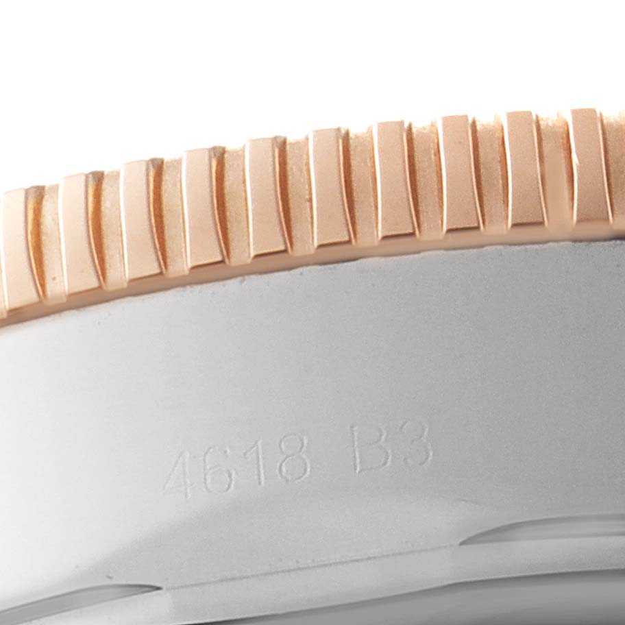 The image shows a close-up of the engraved bezel and case edge of a Breitling Superocean U1331312/BG50/279S/A20D.4 Men's Steel and Gold (two tone) Black Dial U1331312/BG50/279S/A20D.4 Men's Steel and Gold (two tone) Black Dial watch.