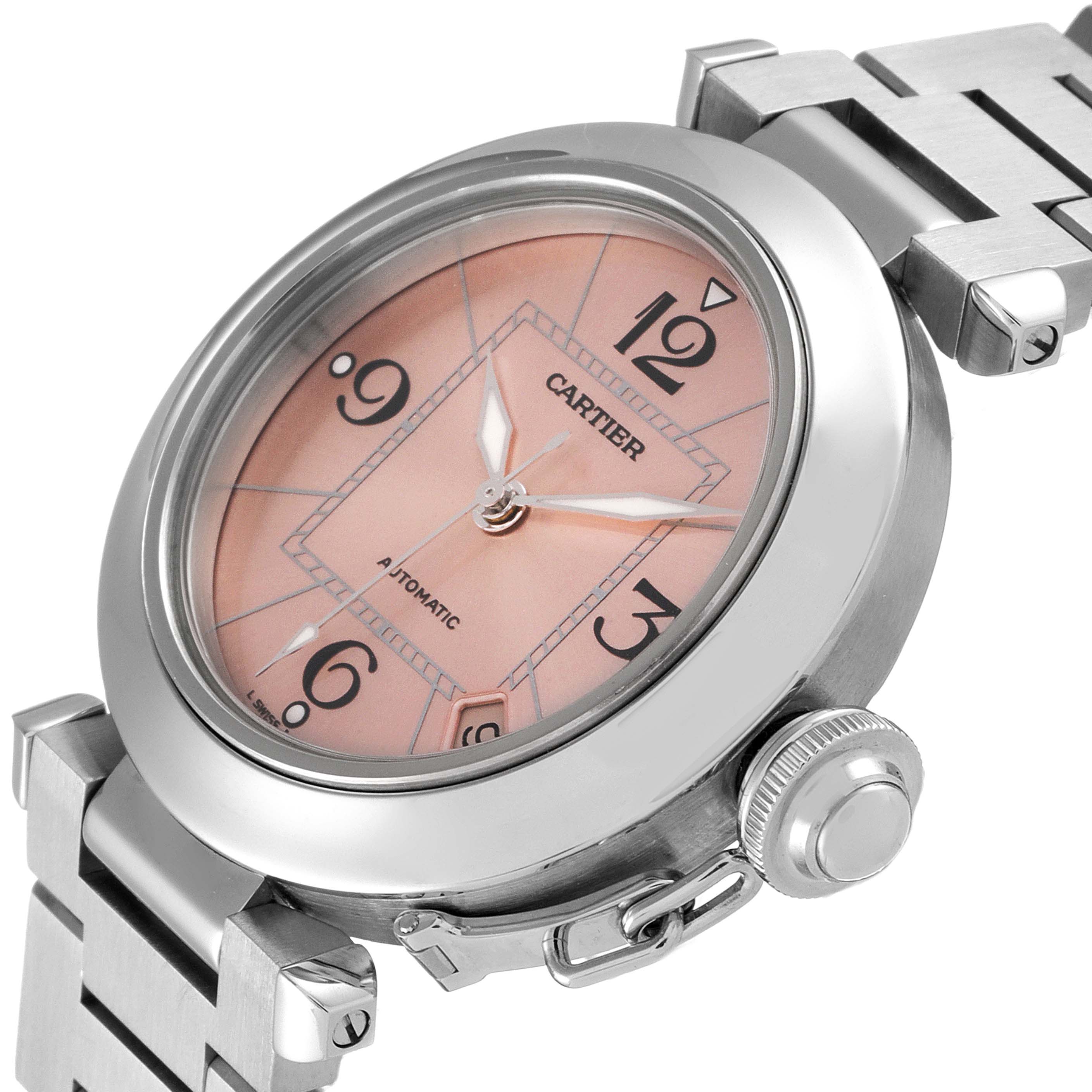 This Cartier Pasha W31075M7 Women's Stainless Steel Pink Dial W31075M7 Women's Stainless Steel Pink Dial watch is shown in an angled close-up, displaying its dial, bezel, crown, and part of the bracelet.