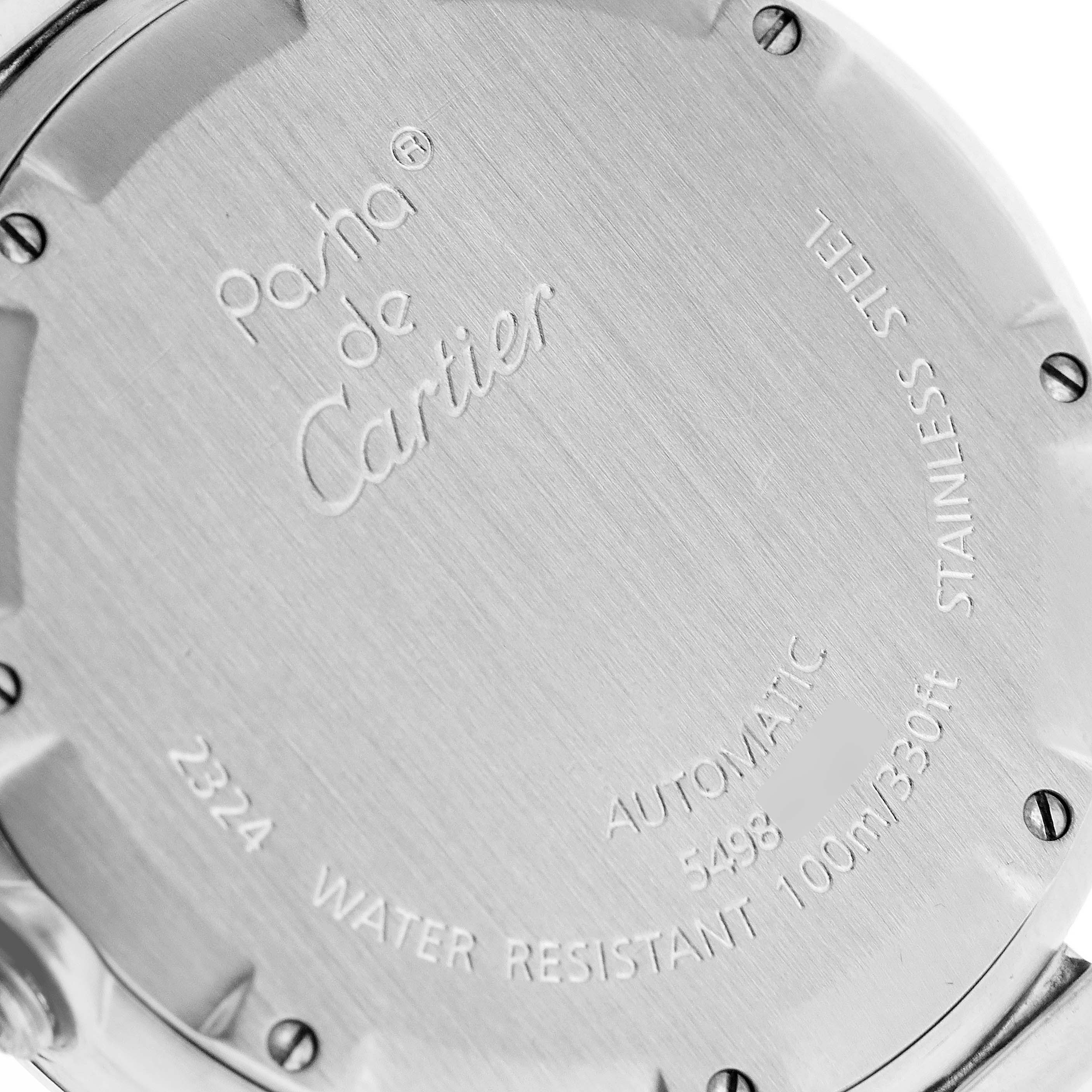 The image shows the back case of a Pasha de Cartier watch, highlighting its inscriptions and screws.
