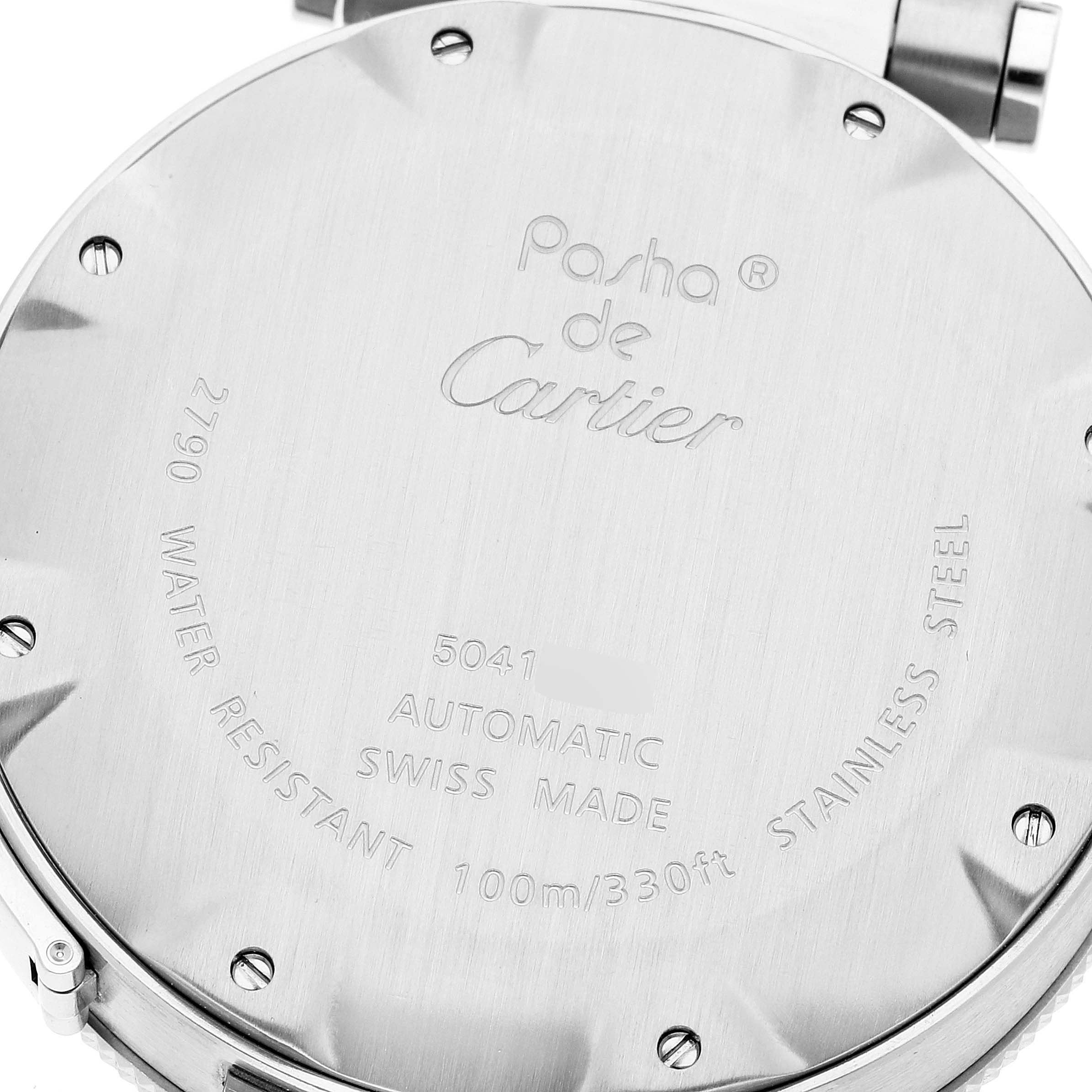 This image shows the back case of a Pasha de Cartier watch, highlighting its markings and screw details.
