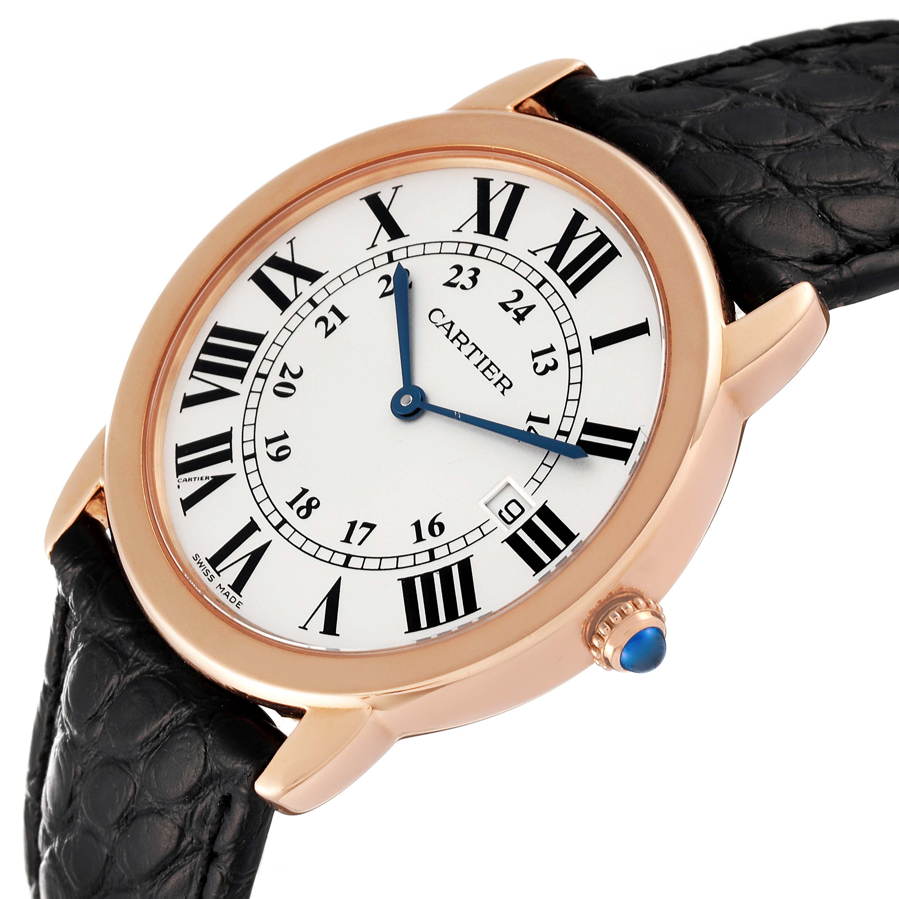 The Ronde model by Cartier is shown from an angled view, displaying the watch face, leather strap, and crown with blue cabochon.