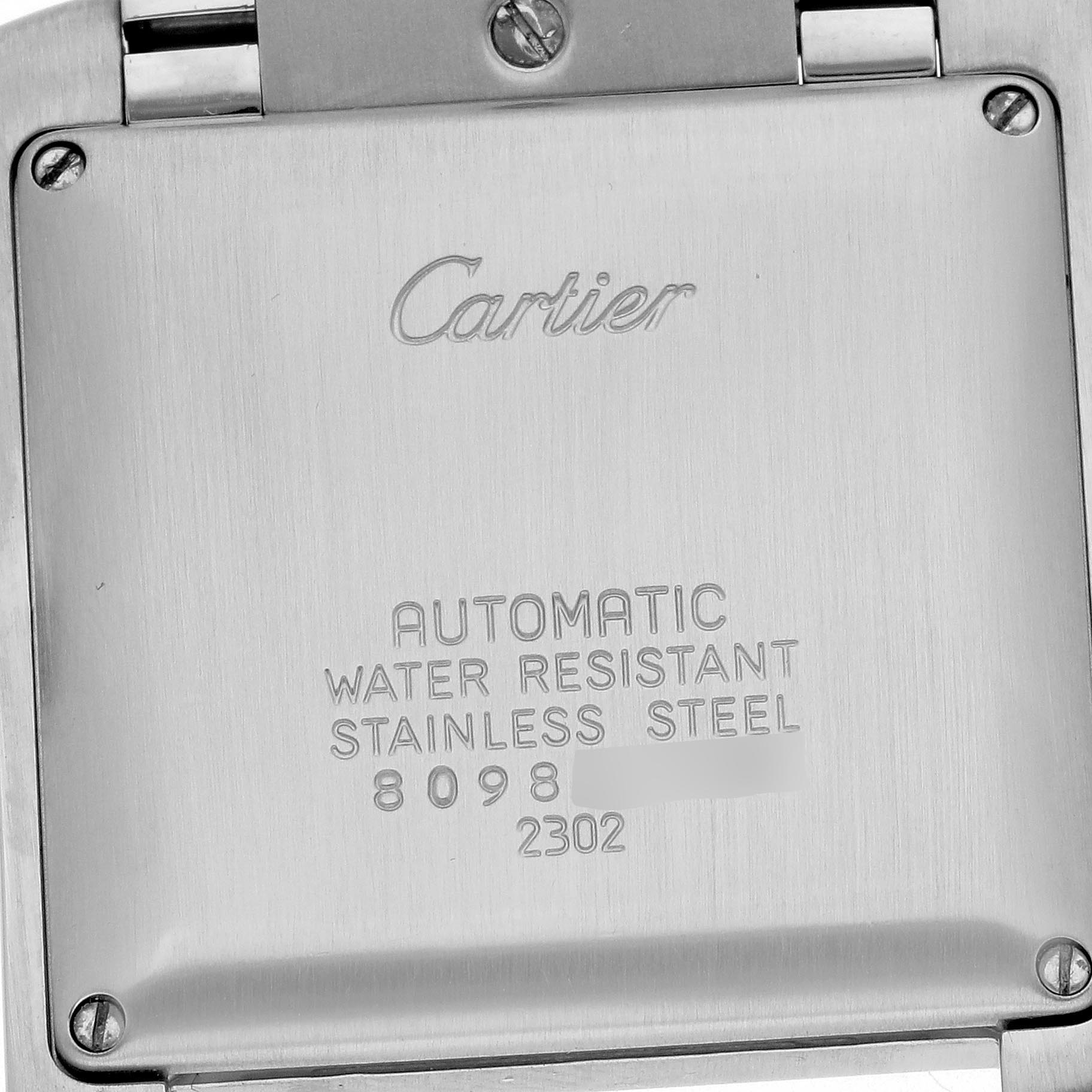 The image shows the back view of a Cartier Tank Française watch with inscriptions and screws visible.