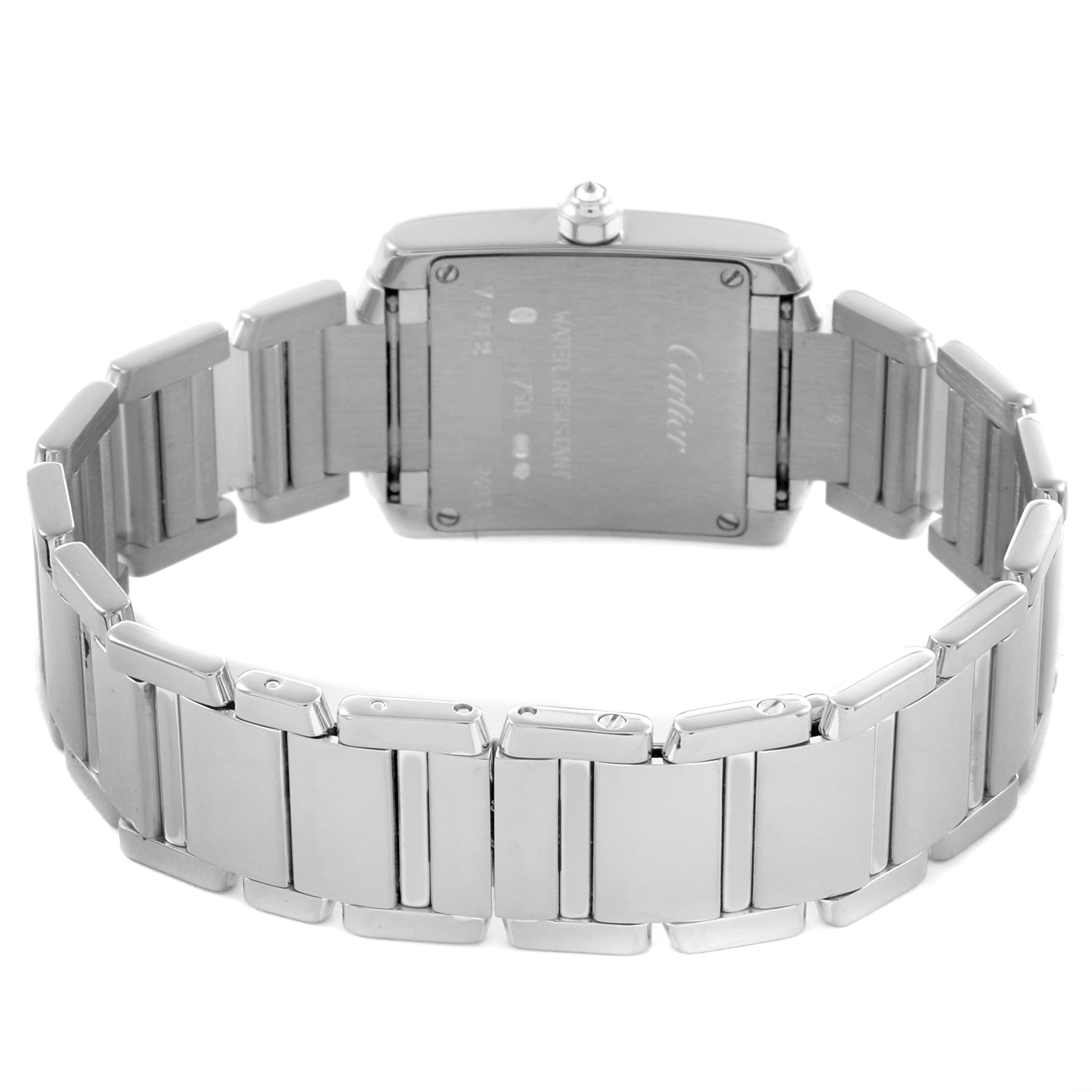 The image shows the back view of a Cartier Tank Française watch, highlighting the case back and metal bracelet.