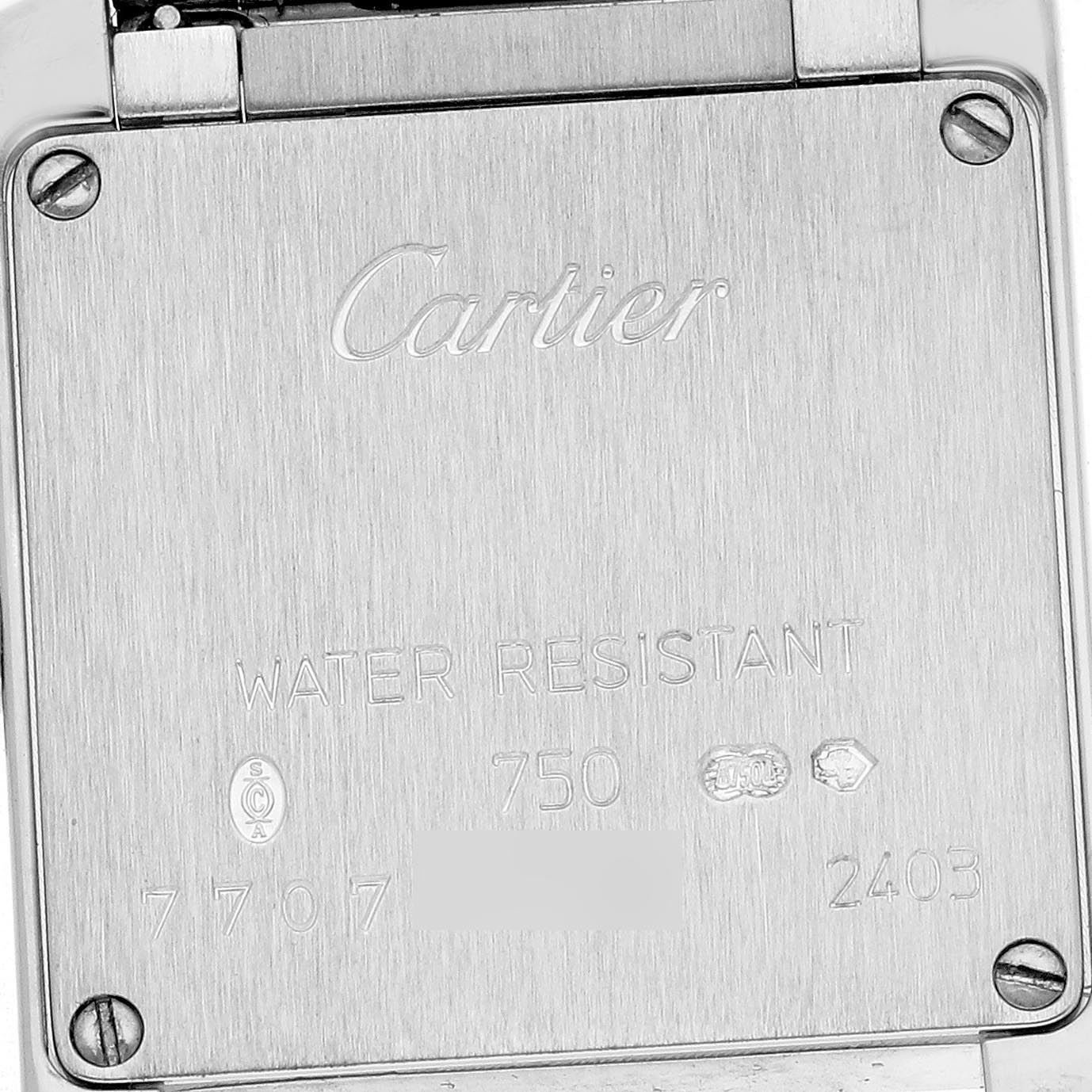 The image shows the back case of a Cartier Tank Francaise WE1002S3 Women's White Gold Silver Dial WE1002S3 Women's White Gold Silver Dial, highlighting engravings and screws.