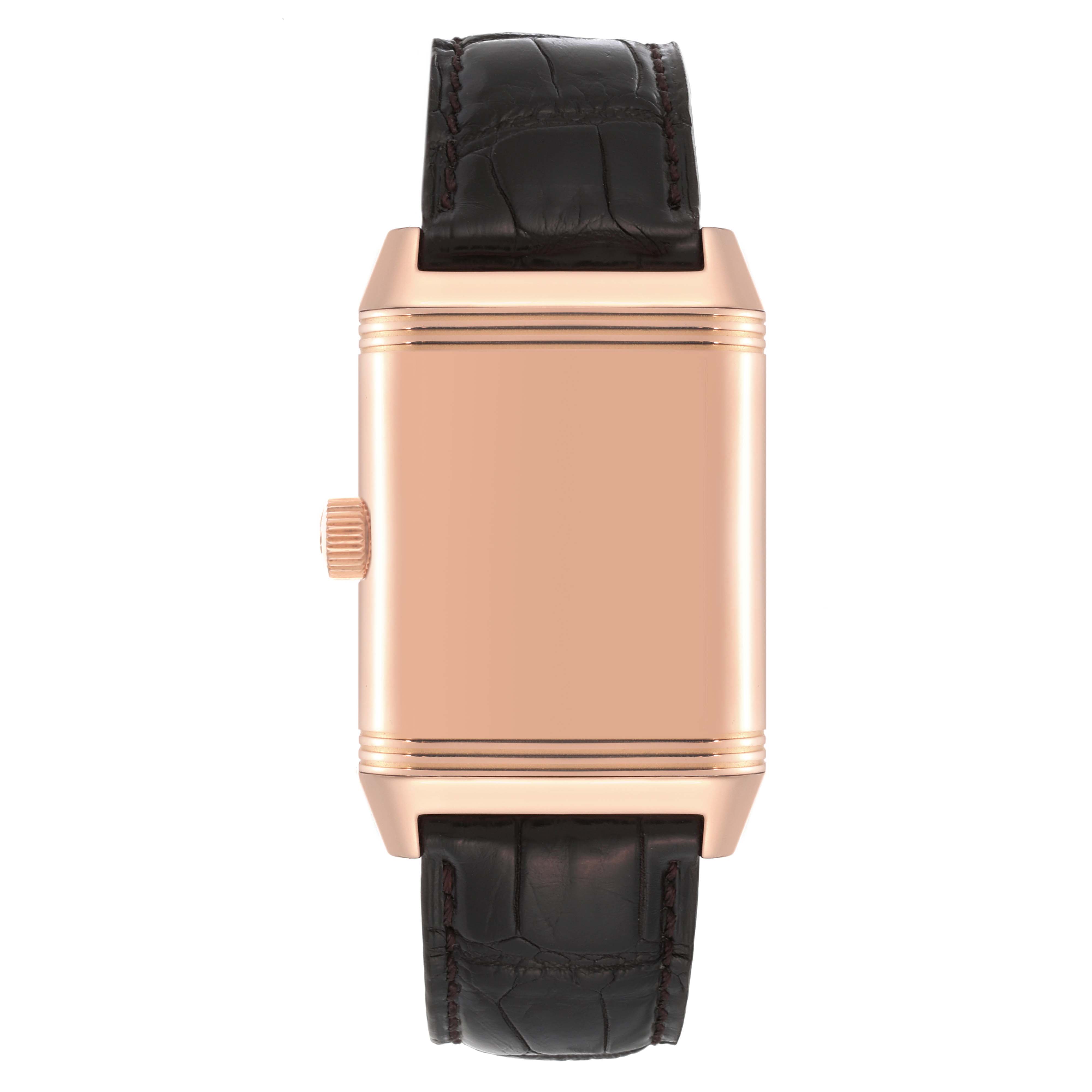 This Reverso watch by Jaeger LeCoultre is shown from a straight-on angle, showcasing its back case and leather strap.