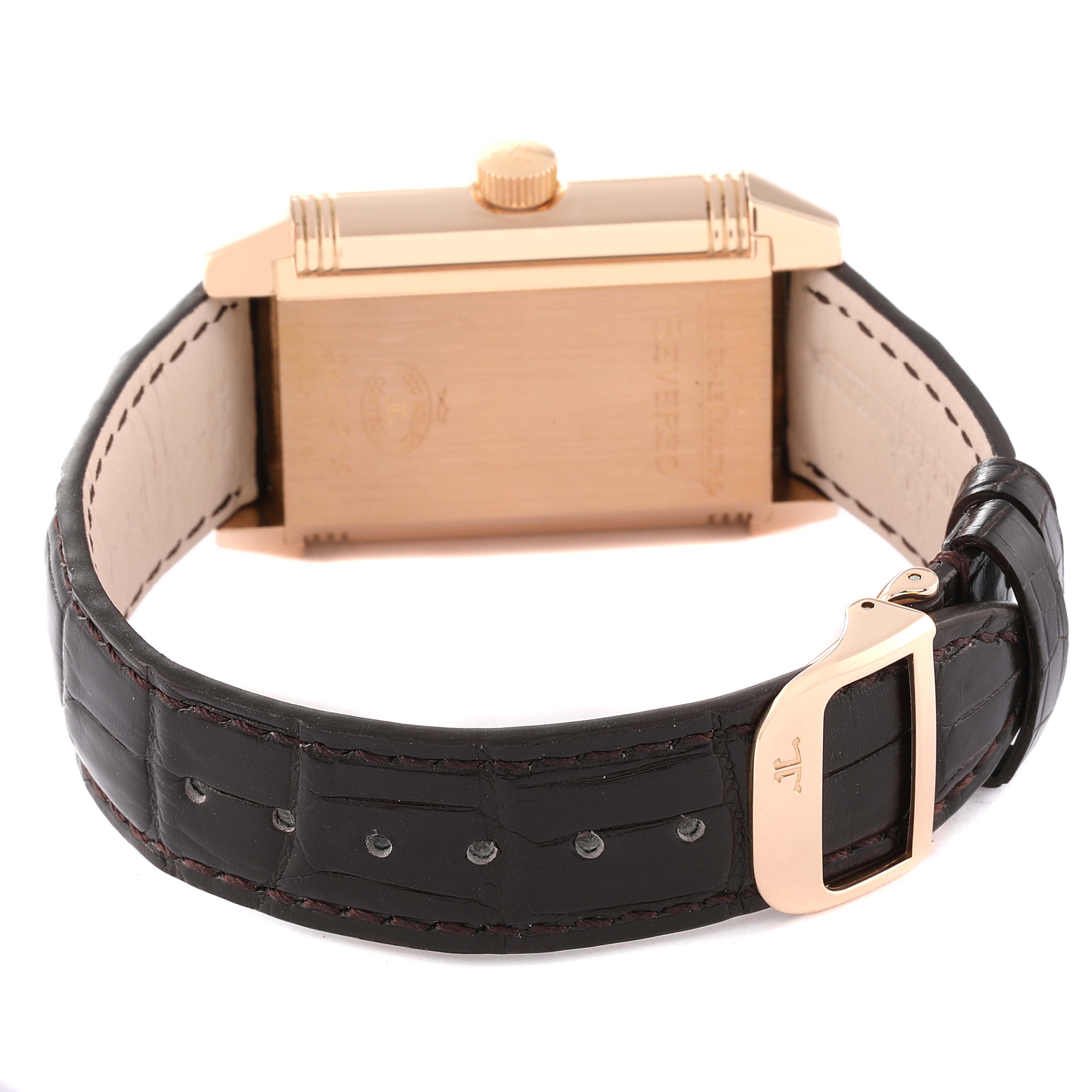 The image shows the back of the Jaeger LeCoultre Reverso Q3032420 Men
s Rose Gold Silver Dial Q3032420 Men
s Rose Gold Silver Dial watch with a leather strap and buckle.