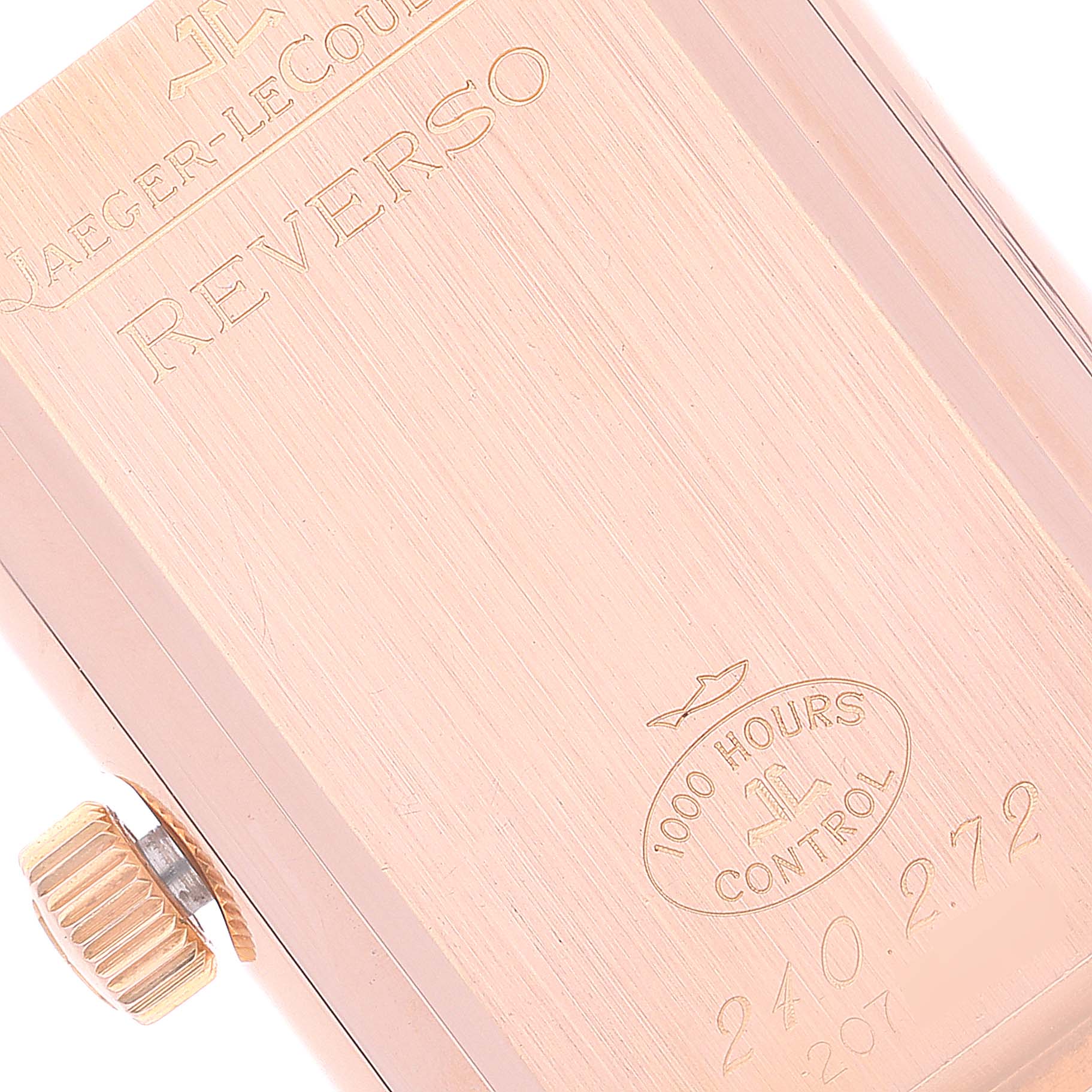 This image shows a close-up of the back case and crown of a Jaeger-LeCoultre Reverso watch.