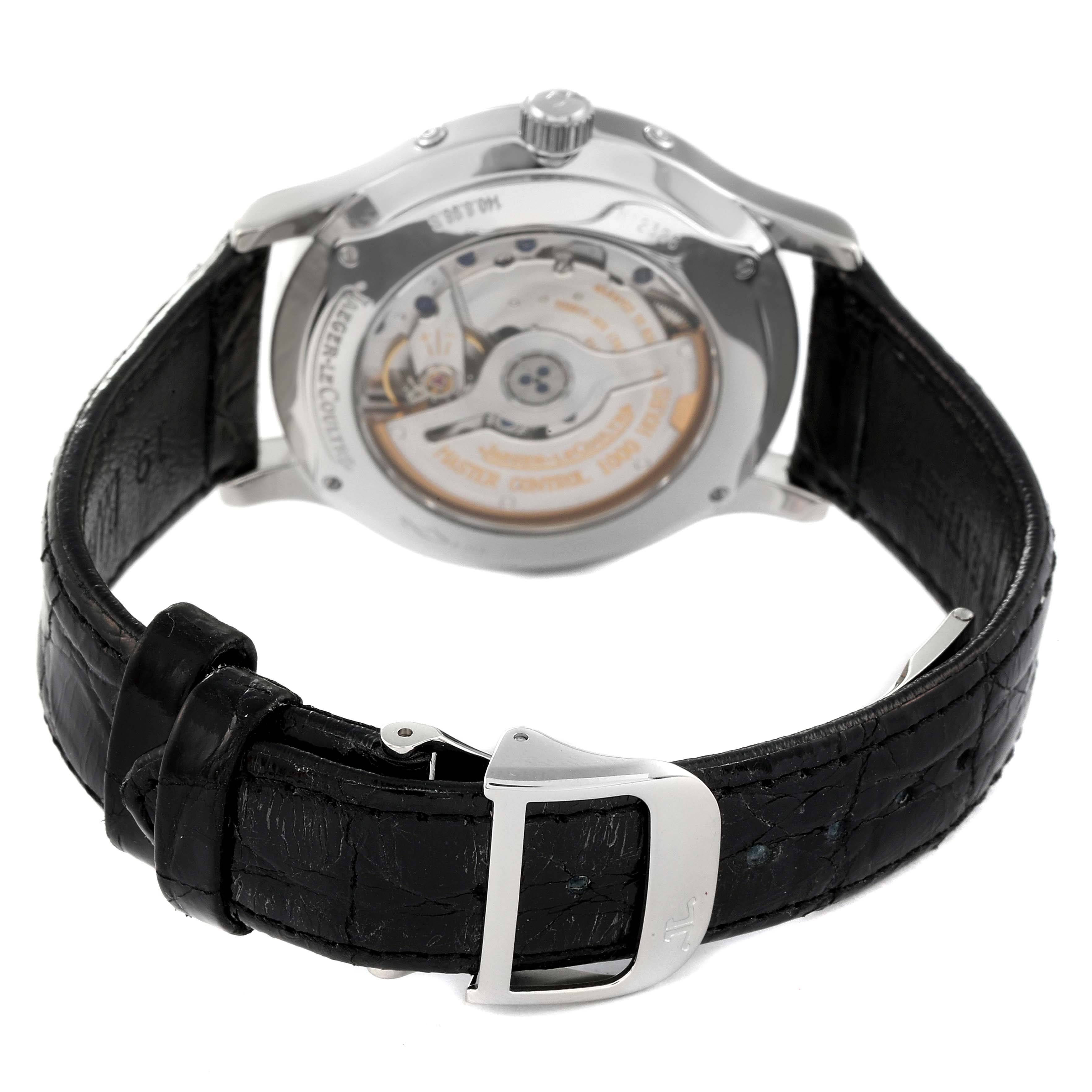 The image shows the back and movement of the Jaeger LeCoultre Master Q1558420 Men's Stainless Steel Silver Dial Q1558420 Men's Stainless Steel Silver Dial model watch, including its black leather strap and clasp.