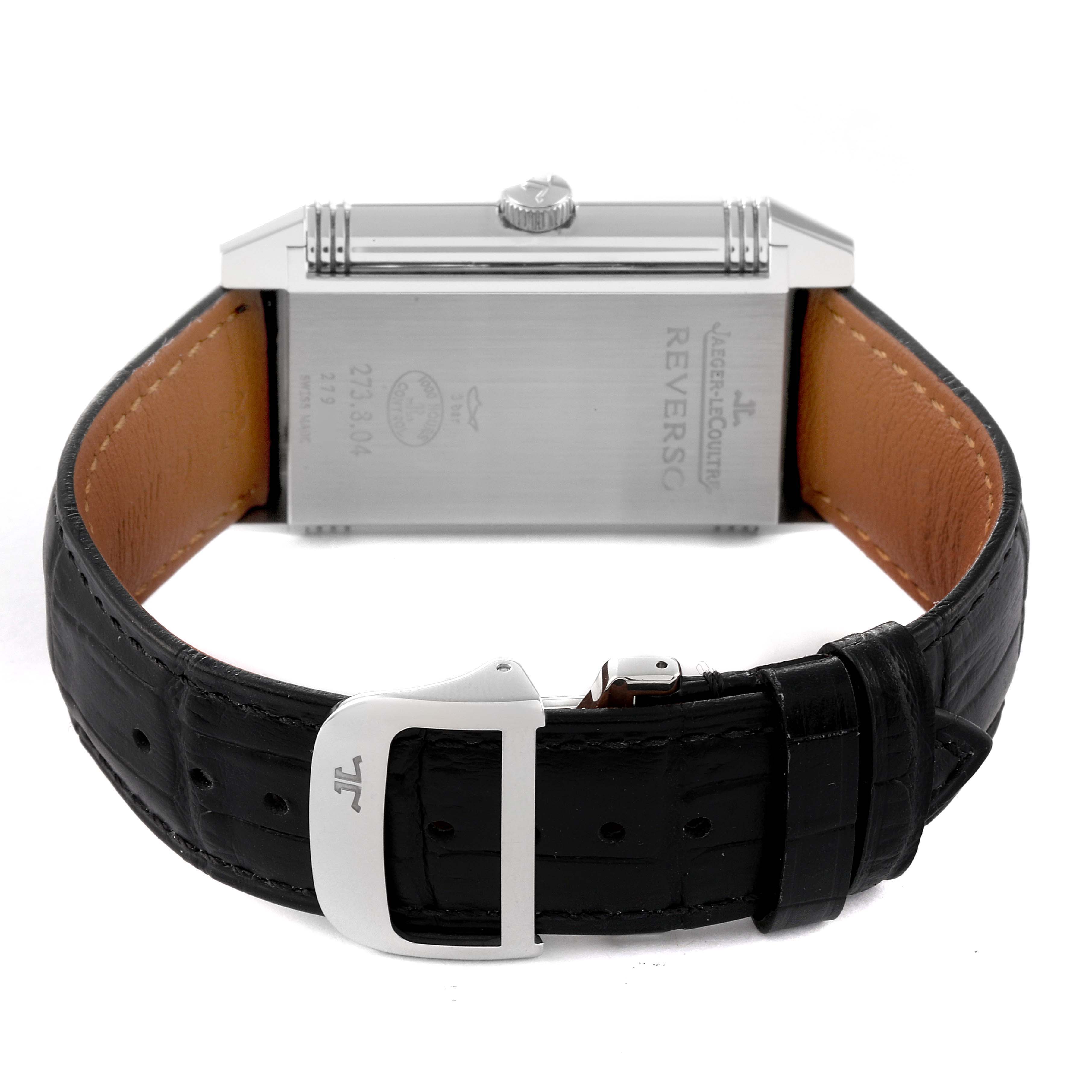 The image shows the back of a Jaeger-LeCoultre Reverso watch with a black leather strap and stainless steel case back.