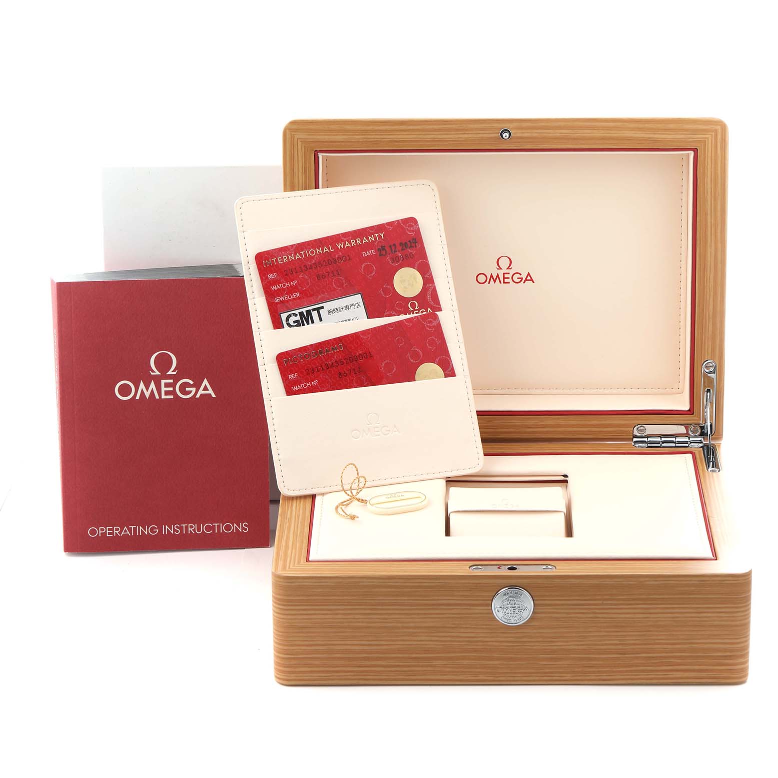 The image shows the packaging and accessories for an Omega Aqua Terra 231.13.43.52.03.001 Men's Stainless Steel Blue Dial 231.13.43.52.03.001 Men's Stainless Steel Blue Dial watch, including a box, warranty card, and operating instructions.