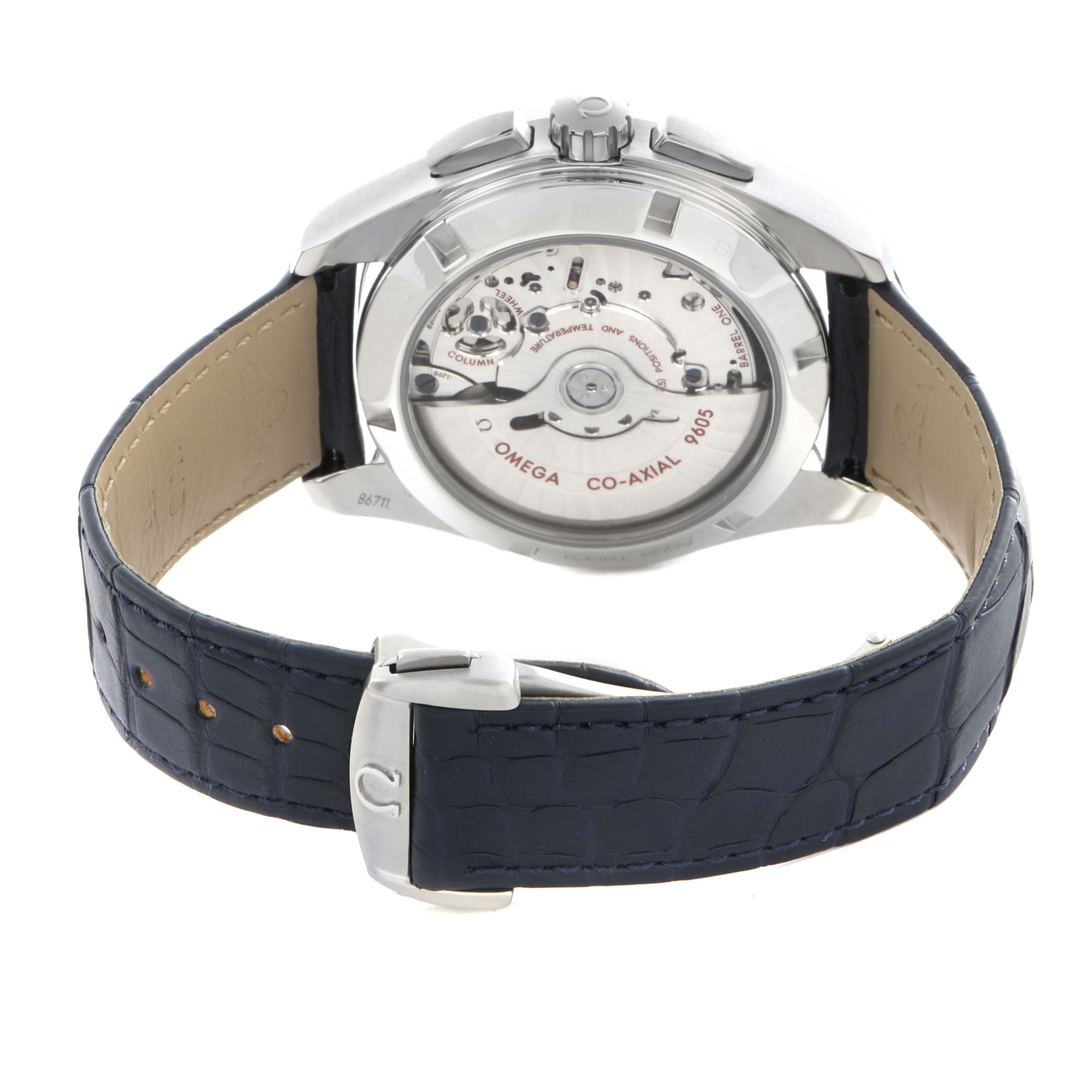 The Omega Aqua Terra 231.13.43.52.03.001 Men's Stainless Steel Blue Dial 231.13.43.52.03.001 Men's Stainless Steel Blue Dial watch is shown from the back, highlighting the movement and the blue leather strap with a buckle.