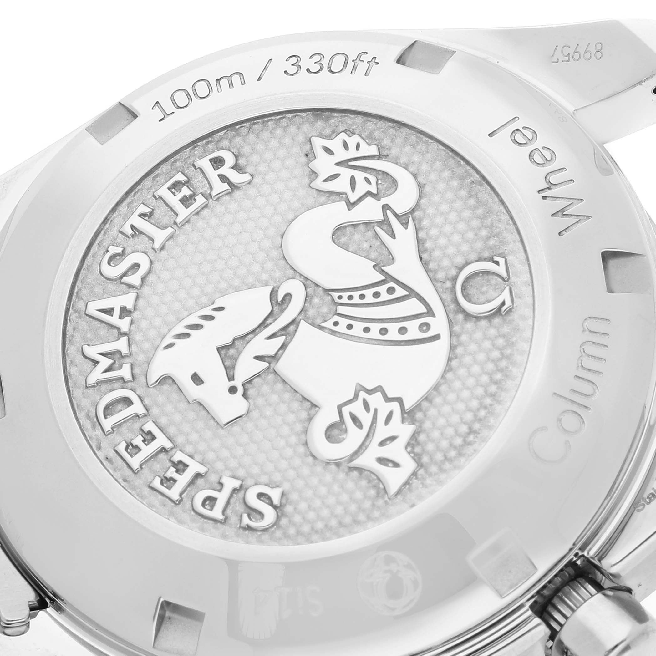 The image shows the back case of an Omega Speedmaster 324.30.38.50.06.001 Men's Stainless Steel Grey Dial 324.30.38.50.06.001 Men's Stainless Steel Grey Dial watch with intricate engravings and branding.