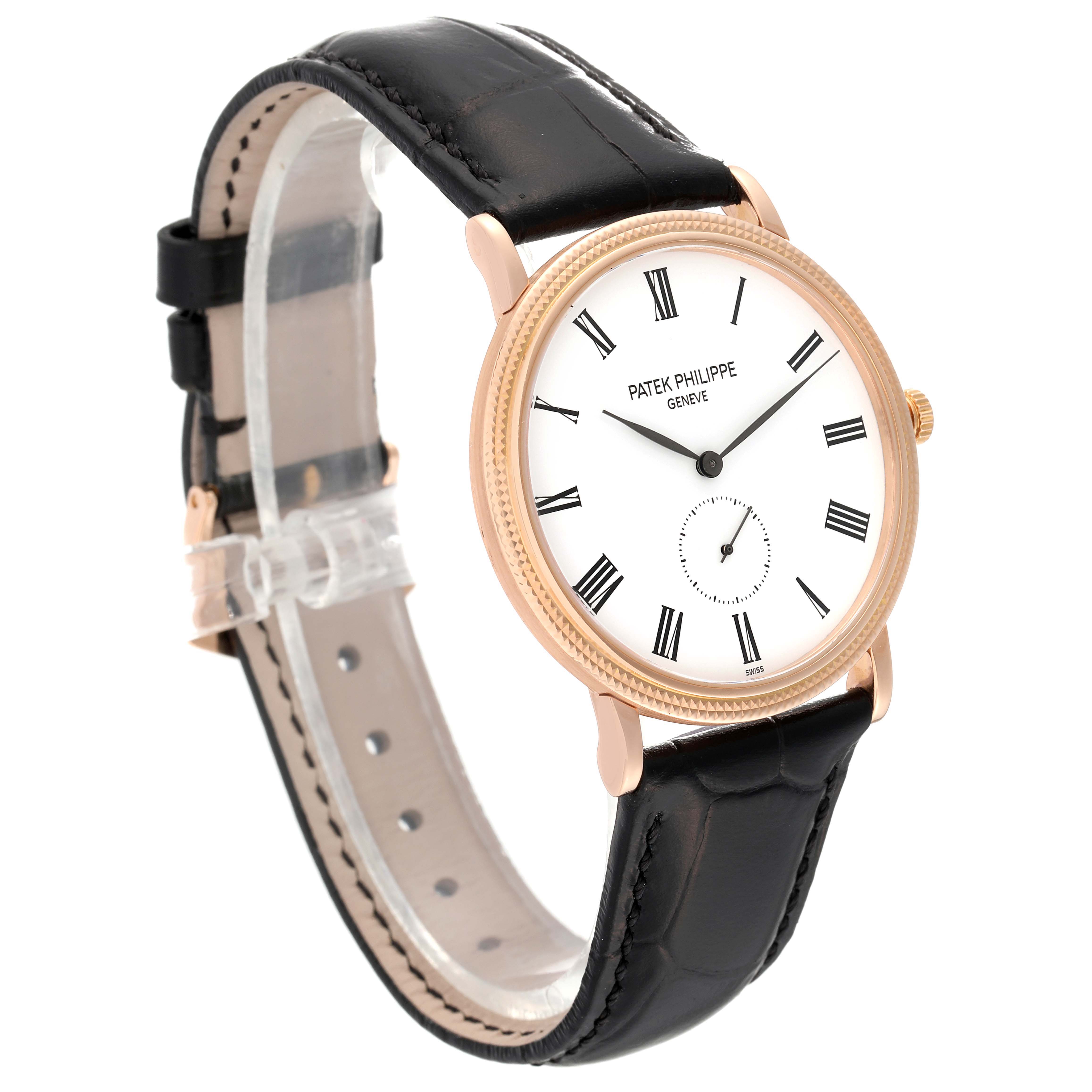 The image shows a Patek Philippe Calatrava 5119R-001 Men's Rose Gold White Dial 5119R-001 Men's Rose Gold White Dial watch at an angled side view, displaying its face, bezel, and black leather strap.