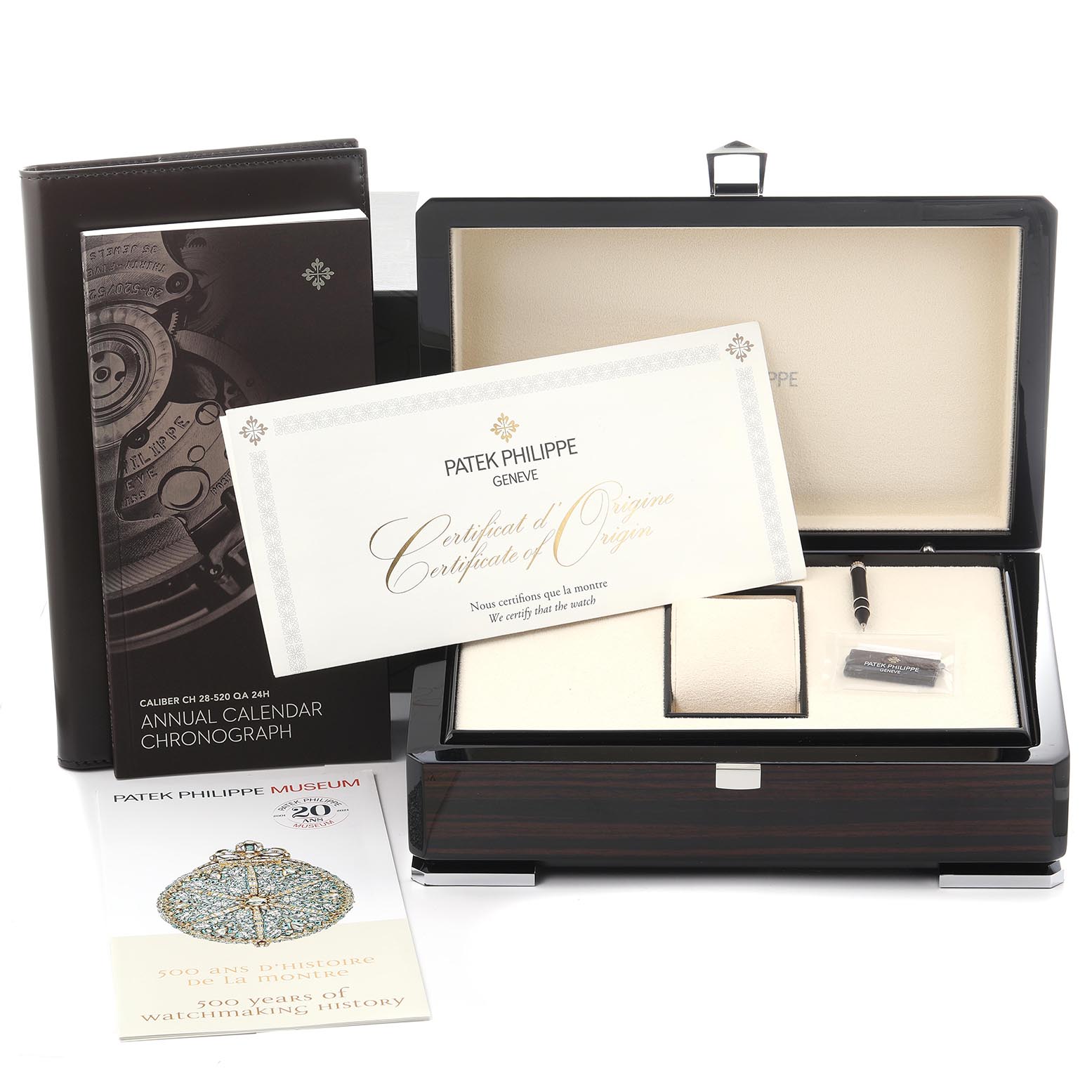 The image shows a Patek Philippe Complications 5905/1A-001 Men's Stainless Steel Green Dial 5905/1A-001 Men's Stainless Steel Green Dial watch box, certificate, manual, and accessories from a top-front angle.